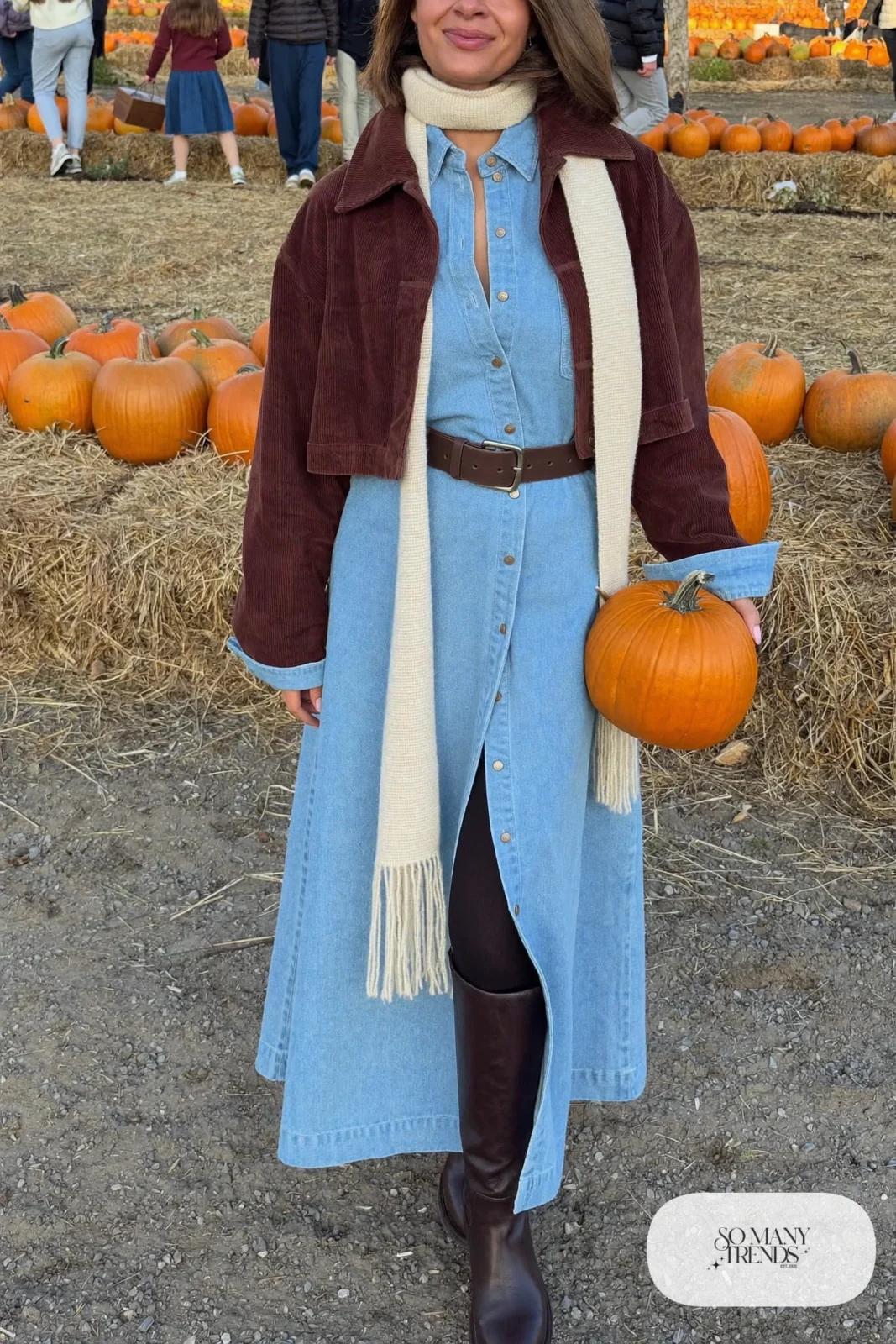 Light blue denim midi shirt dress with a wide brown leather belt, cropped brown jacket and tall brown boots, outfit 19
