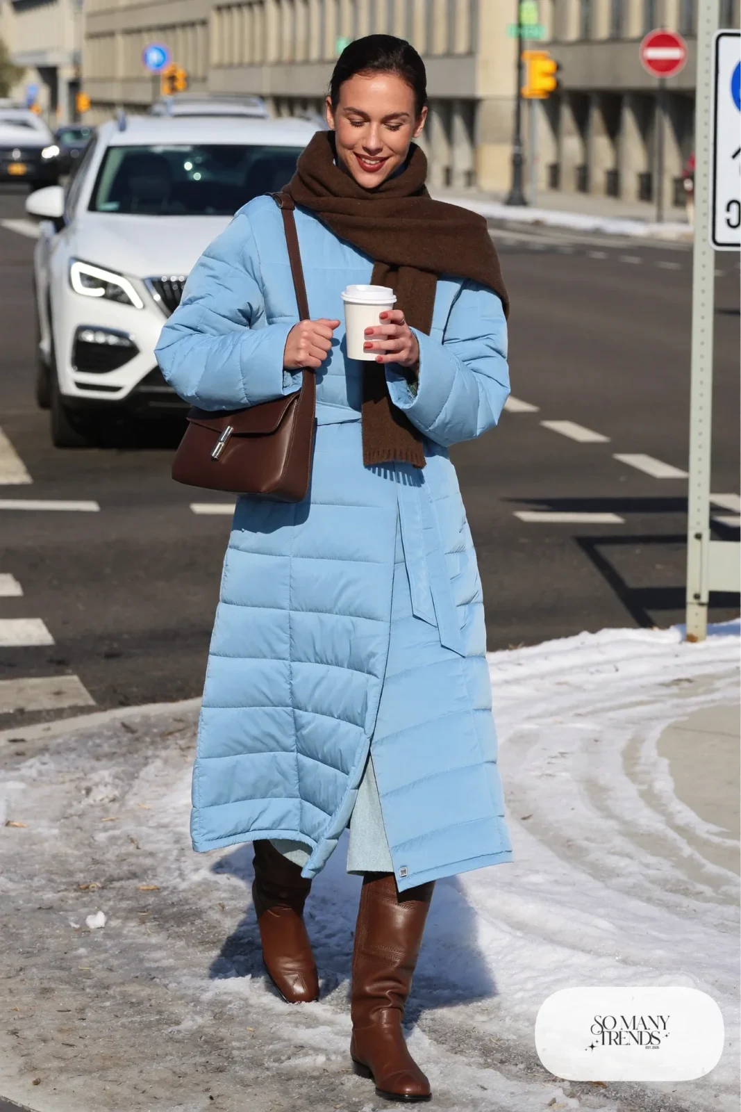 Light blue quilted midi coat with a brown scarf, brown leather bag and brown boots, outfit 27
