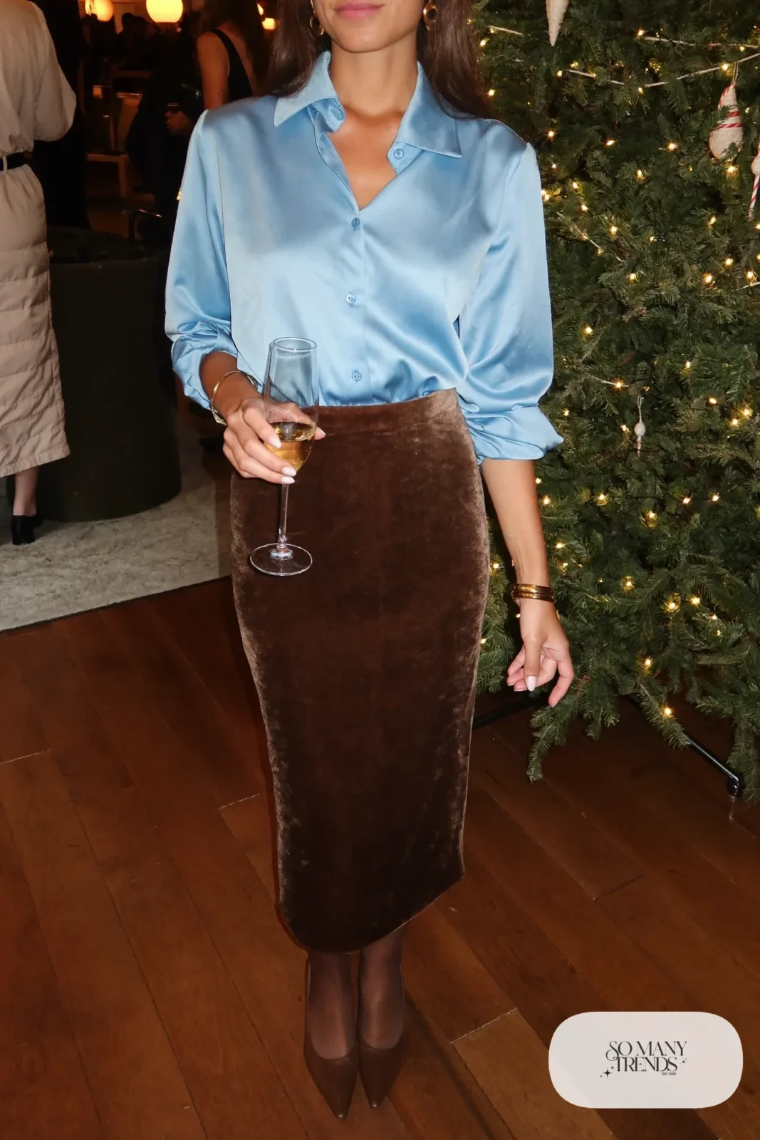 Sky blue satin blouse with a chocolate velvet midi skirt, sheer tights, brown pumps and gold jewelry, outfit 30