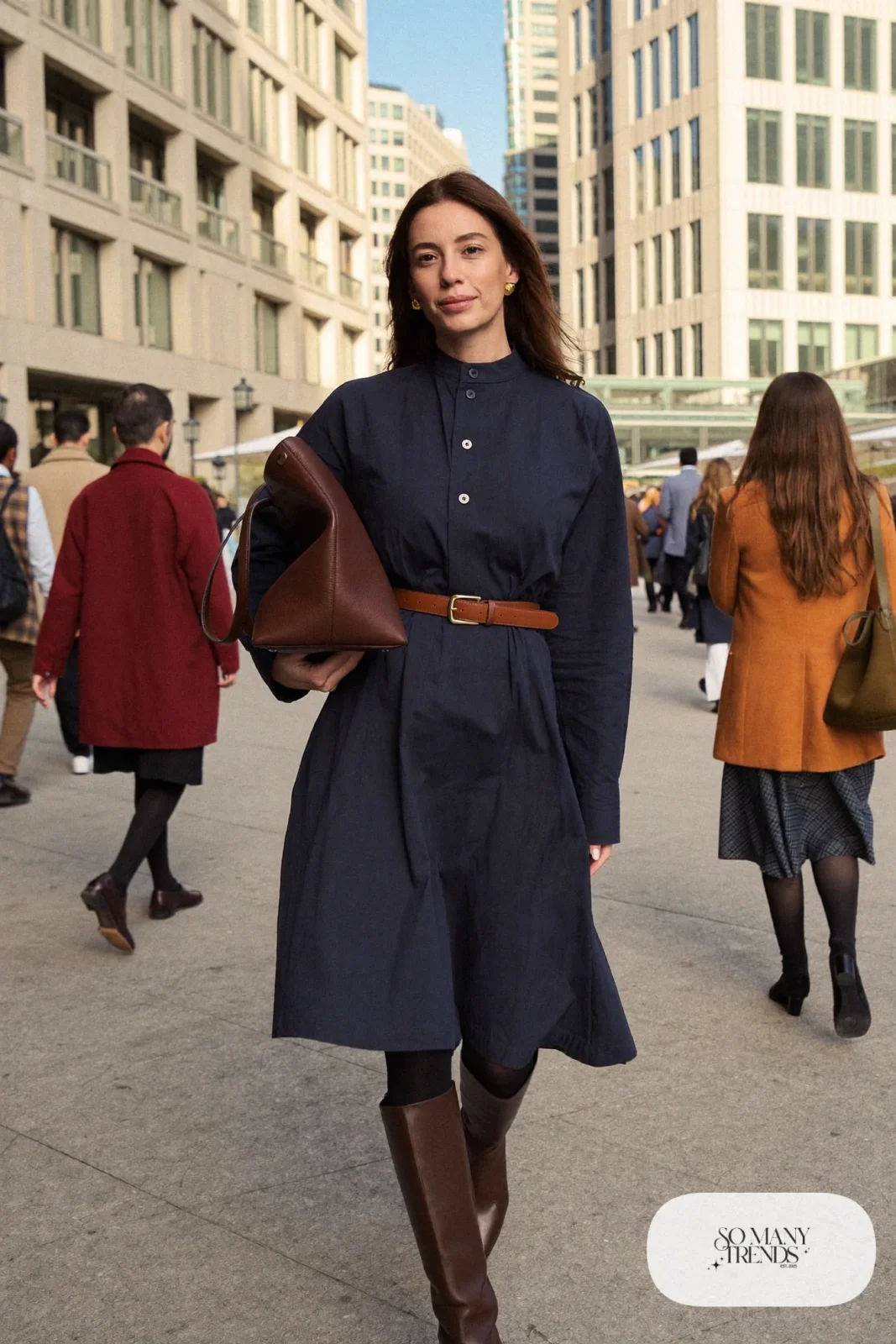 Woman in a navy midi shirt dress, wide cognac leather belt and brown tall boots, outfit 10
