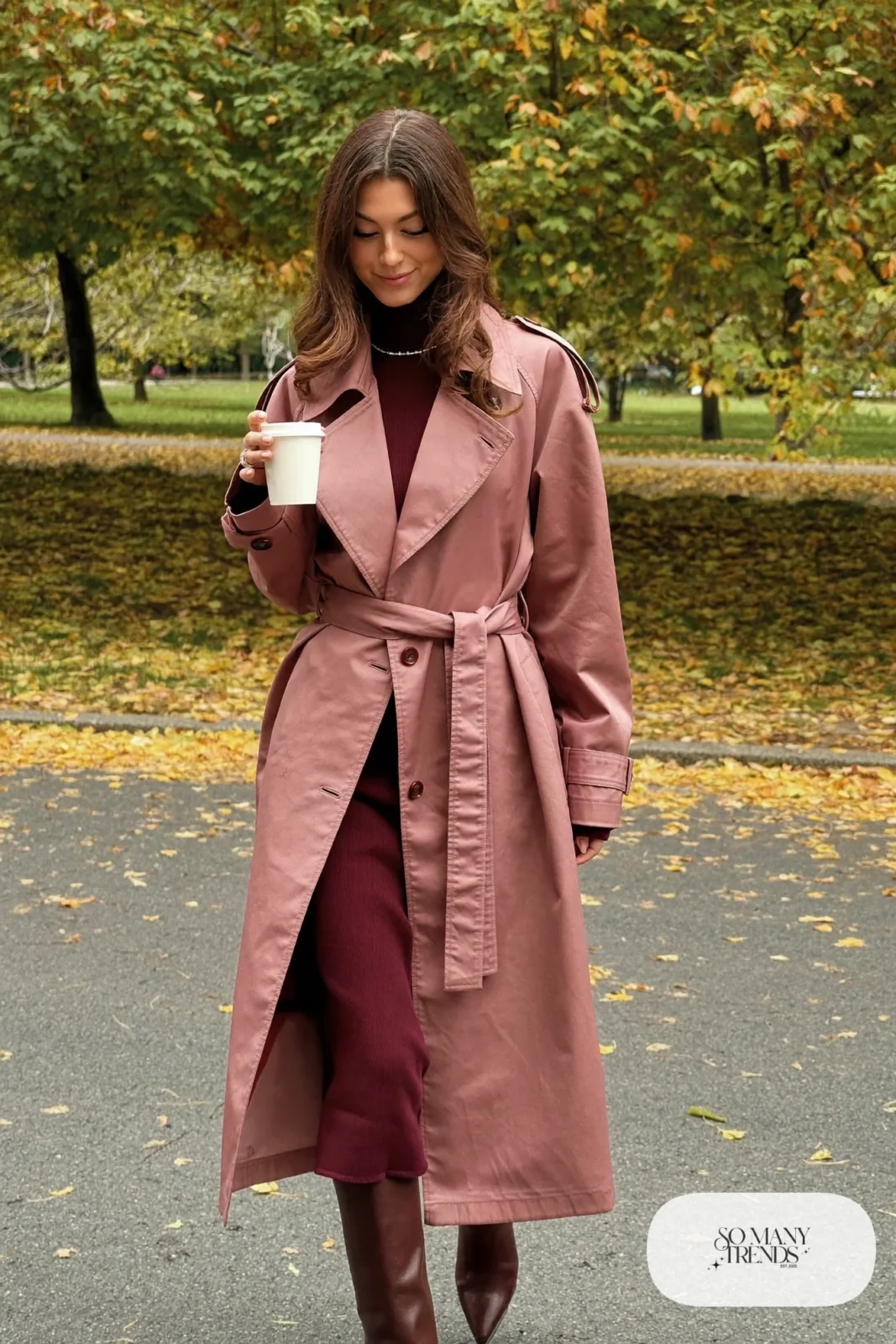 Woman in blush pink trench coat, burgundy rib-knit midi dress and brown knee-high leather boots, outfit 5