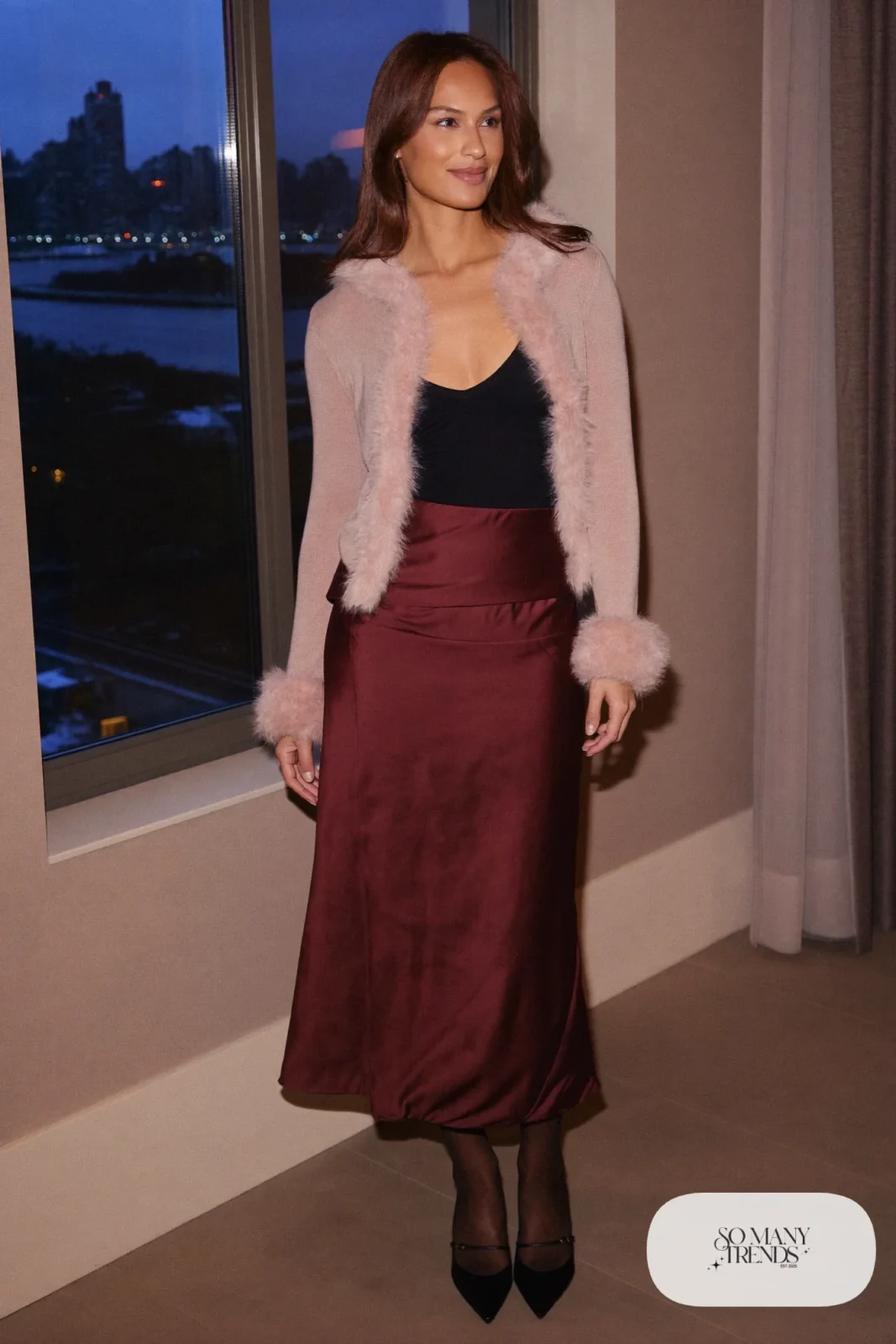 Woman in short pink cardigan with fluffy trim, wine satin midi skirt, sheer tights and black slingback pumps, outfit 26