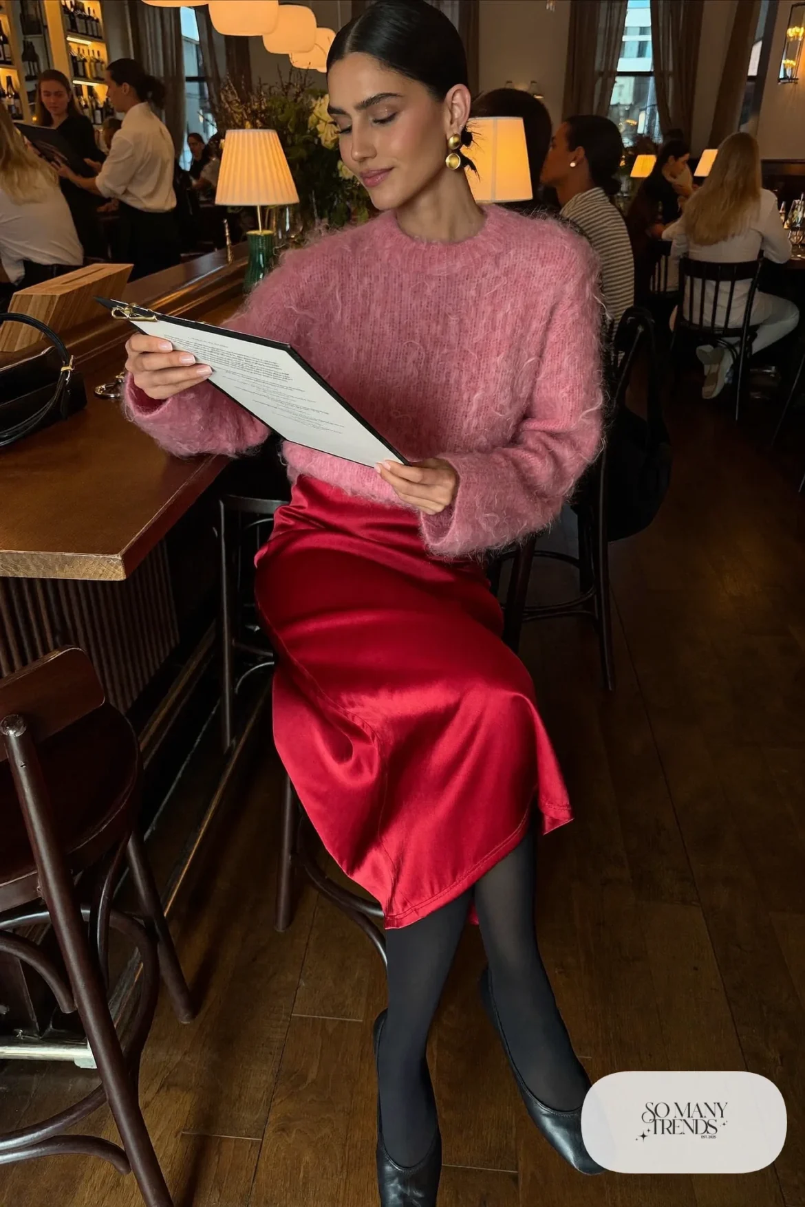 Woman in a fuzzy pink mohair sweater tucked into a scarlet satin midi skirt with black ballet flats, outfit 4