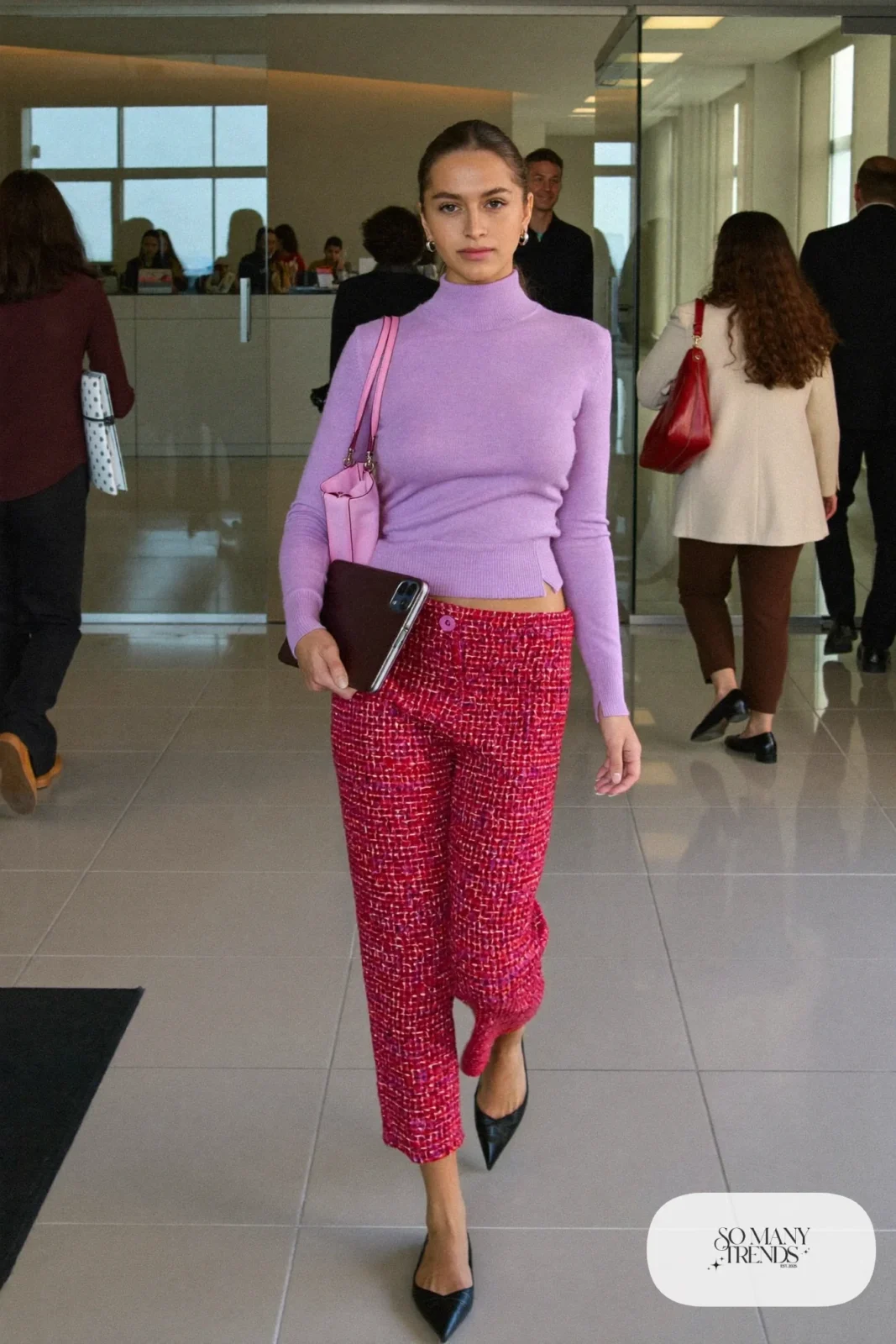 Woman in a lilac mock-neck sweater, cropped red tweed pants, black flats and a blush pink bag, outfit 6