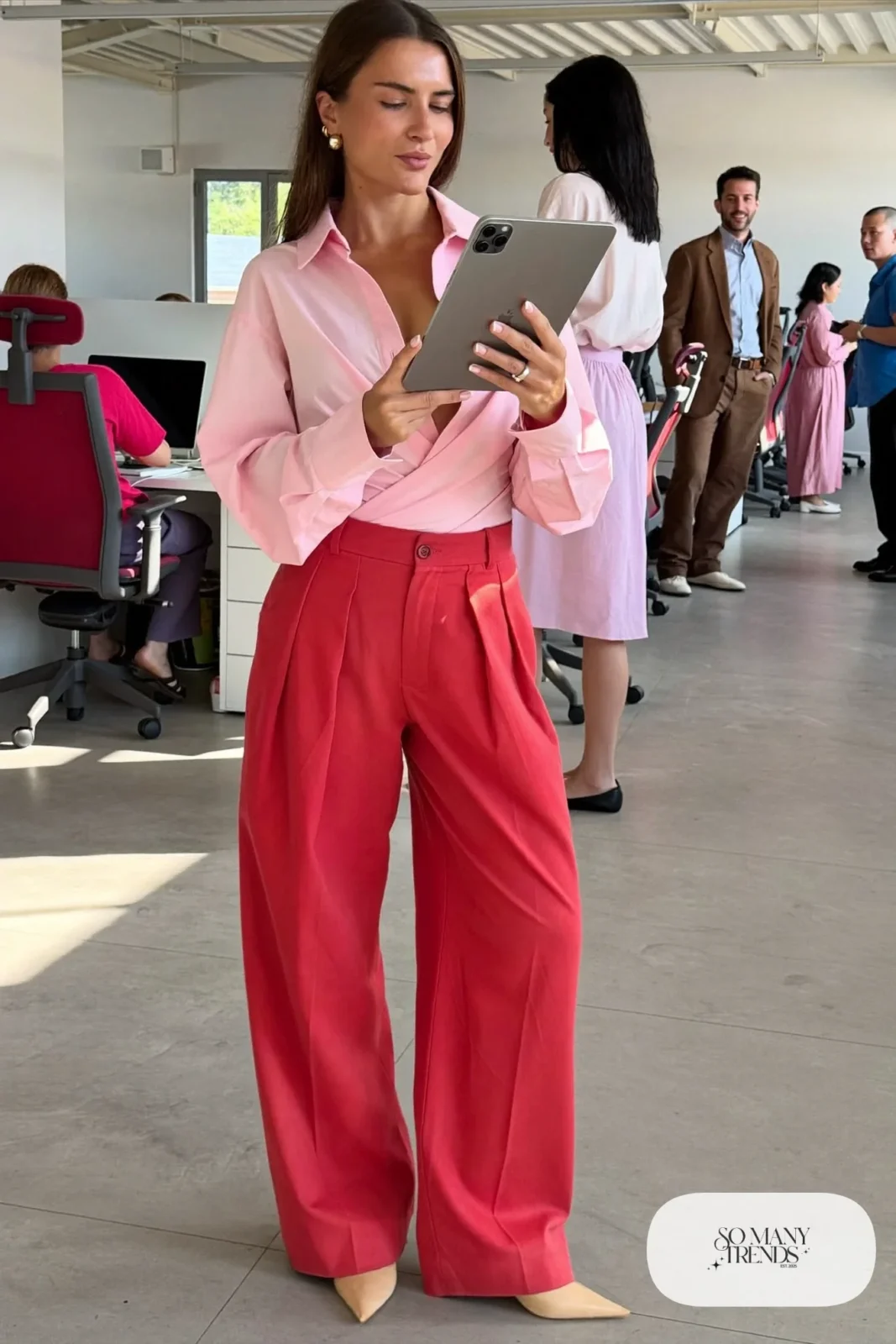 Woman in a pink wrap blouse, red pleated wide-leg pants and nude pointed flats, outfit 22