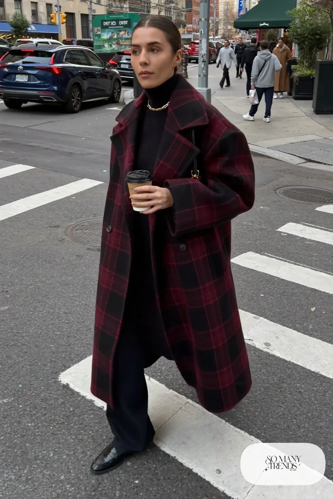 Woman in a black and wine plaid wool coat, black turtleneck, black wide-leg pants and black loafers, outfit 23