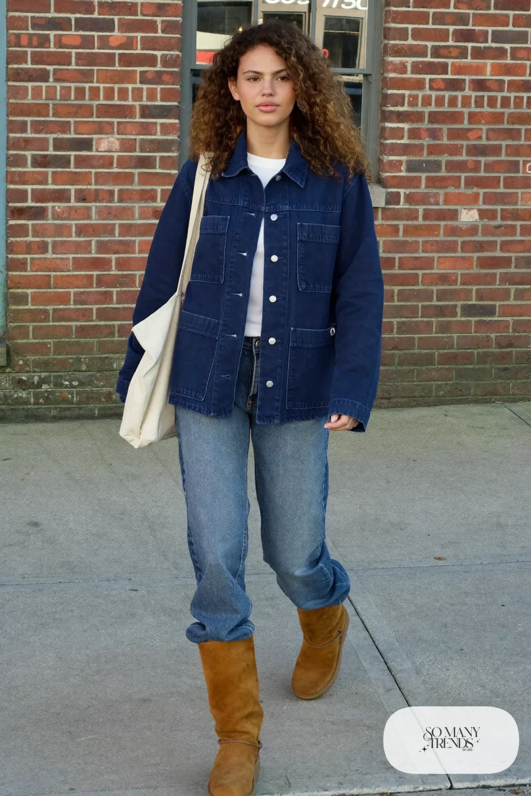 Woman in navy chore jacket, white tee, barrel-leg jeans and camel suede ankle boots, outfit 8