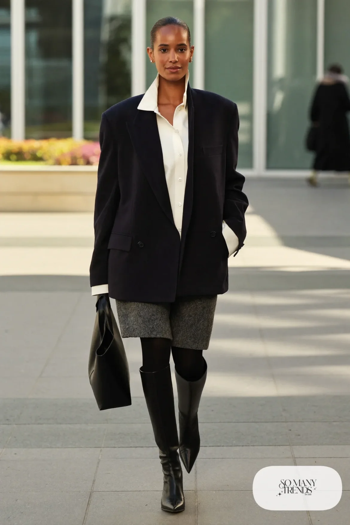 Woman in navy blazer, white shirt, gray pencil skirt and black pointed kitten-heel knee boots, outfit 17