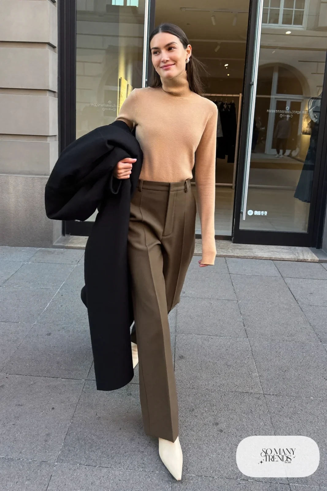Woman in camel turtleneck, olive wide-leg pants and cream kitten-heel ankle boots, outfit 18