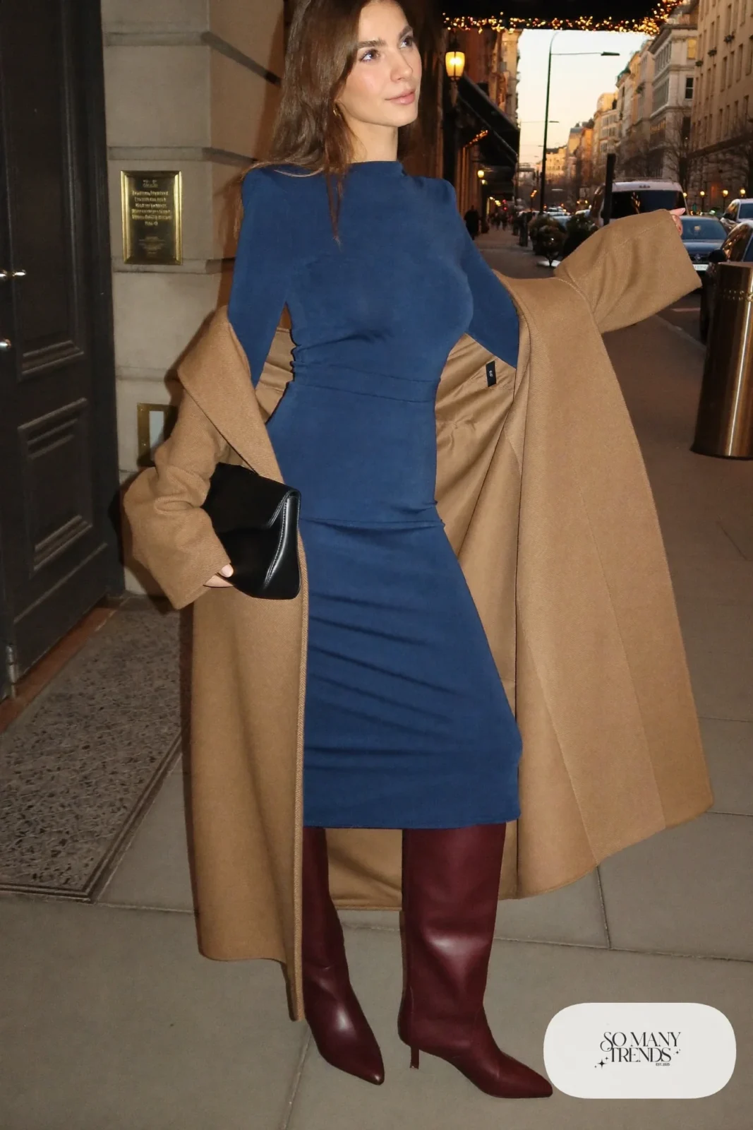 Woman in ink blue midi dress, camel coat and burgundy kitten-heel knee boots, outfit 19