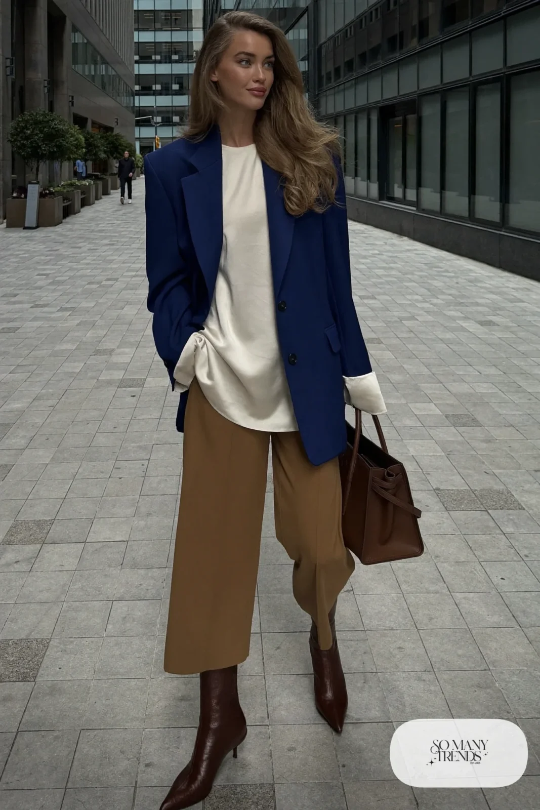 Woman in oversized ink blue blazer, cream top, cropped wide pants and chocolate kitten-heel boots, outfit 20
