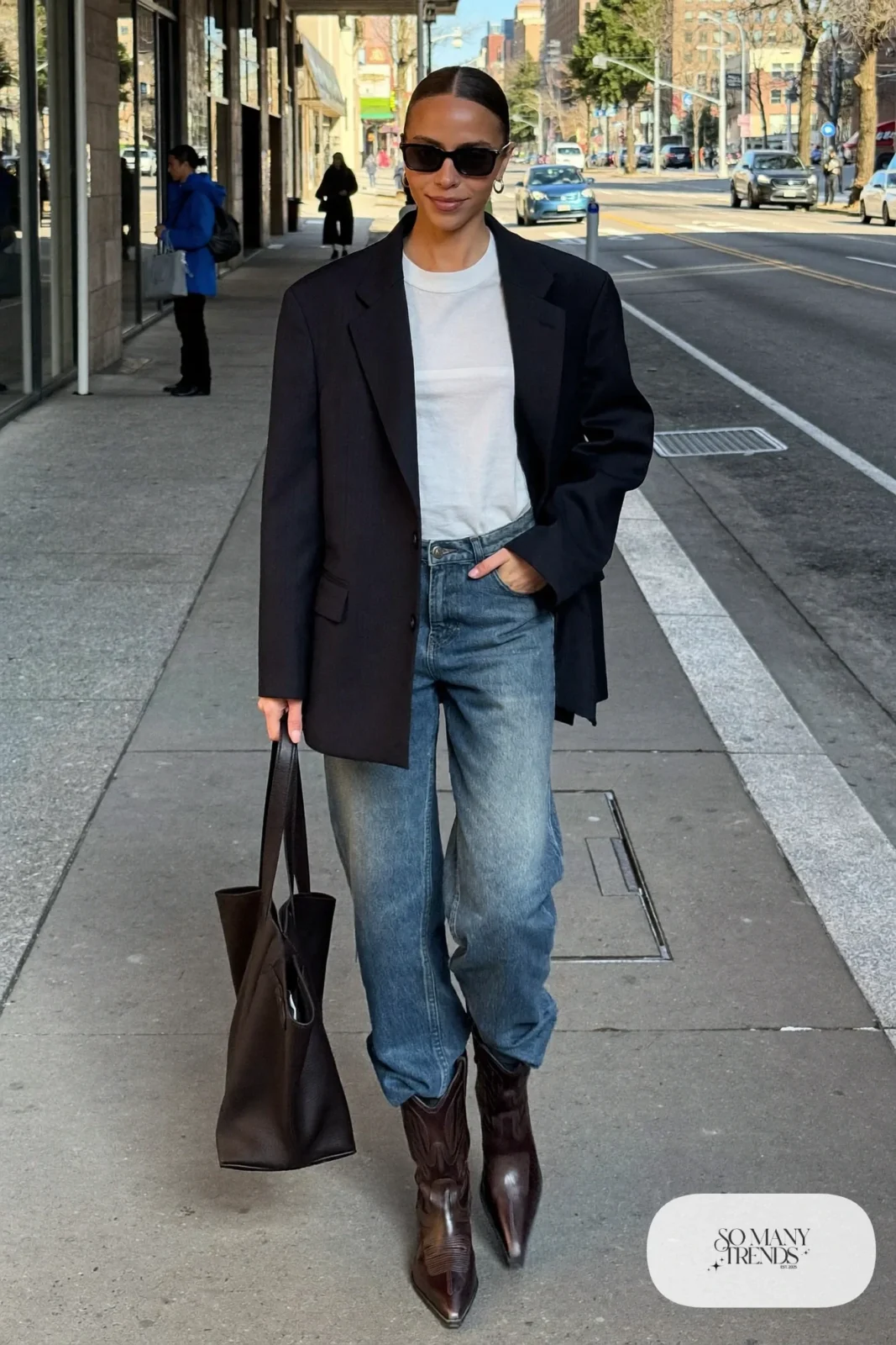 Woman in navy blazer, white tee, straight jeans and brown western boots, outfit 22