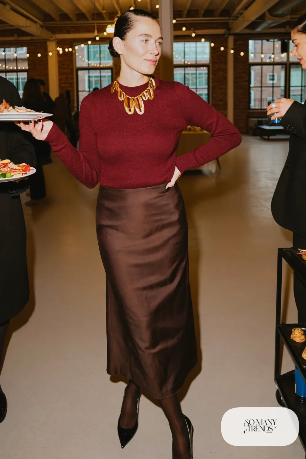Look 6: burgundy fine-knit crewneck sweater, gold chunky collar necklace, chocolate satin midi skirt, black kitten heel pumps