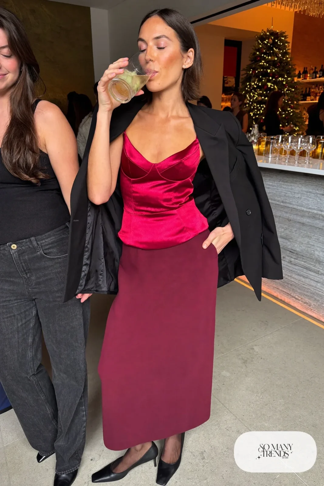 Look 9: cherry red satin bustier top, oxblood long column skirt, black structured blazer, black pumps, sheer tights