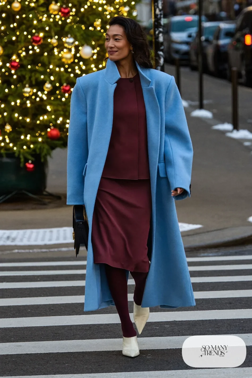 Look 25: long sky blue wool coat, burgundy crepe midi dress, cream pointed boots, small black bag
