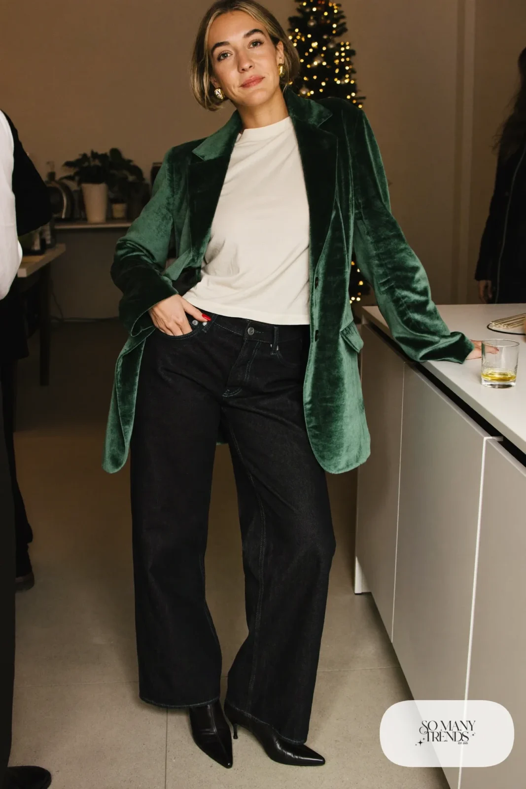 Look 27: forest green velvet blazer, cream tee, dark wide-leg jeans, heeled ankle boots, gold earrings