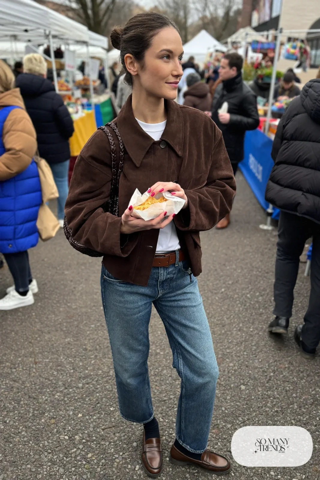 Woman in cropped chocolate brown suede-look jacket, white tee, mid-blue straight jeans and brown loafers, outfit 2