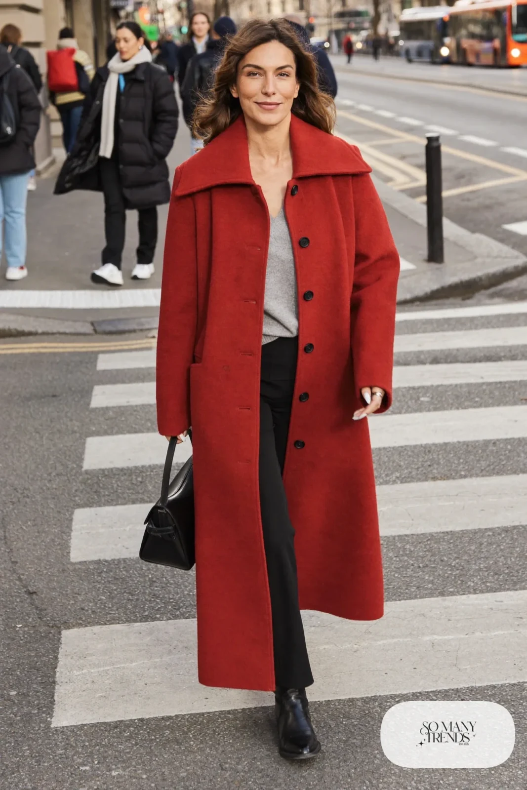 Woman in long cherry red wool coat, gray knit sweater, black straight pants and black leather boots, outfit 11