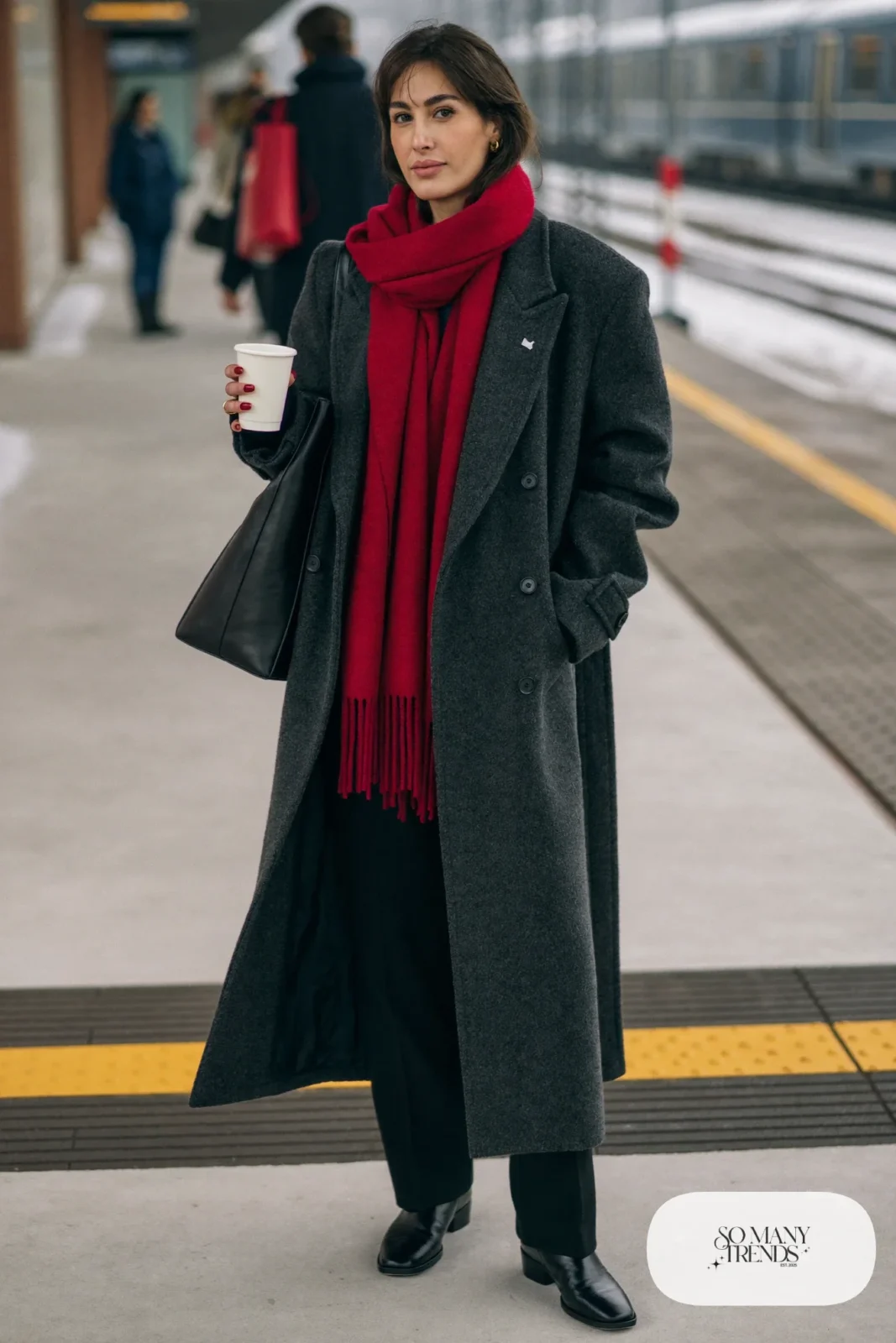 Woman in large cherry red wool scarf, charcoal wool coat, black sweater, black pants and black boots, outfit 14