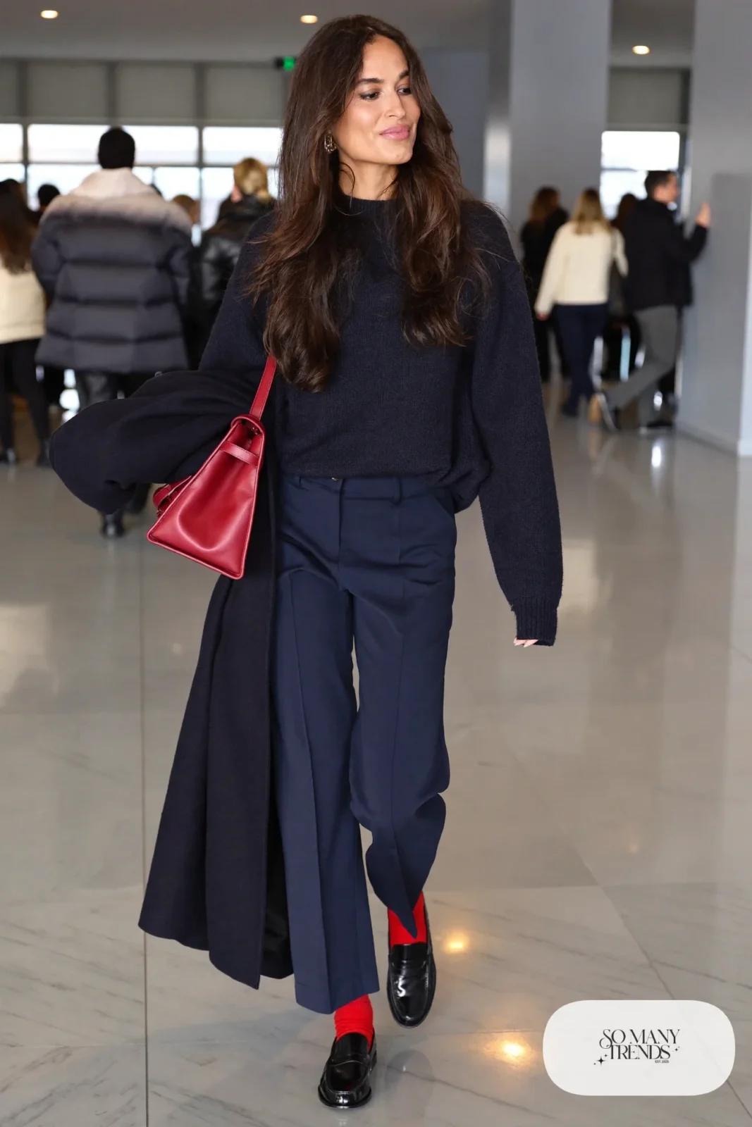 Woman in navy wool sweater, navy straight pants, navy coat, cherry red leather bag and black loafers, outfit 29