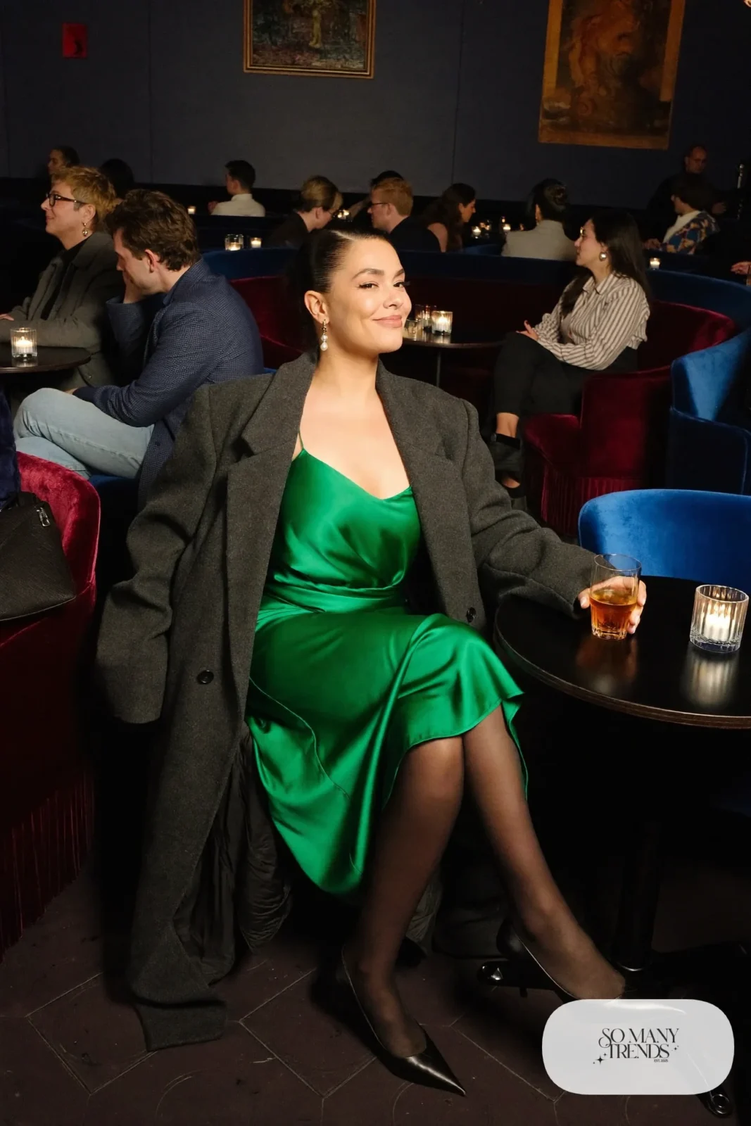 Emerald satin slip dress with long charcoal wool coat, sheer black tights and pointed black pumps, outfit 1