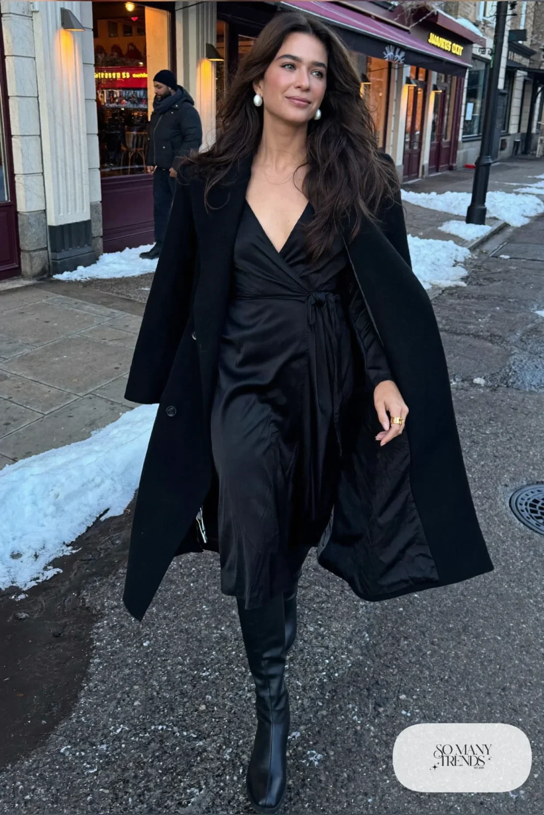 Black satin midi wrap dress with tall black boots and structured wool coat, outfit 17