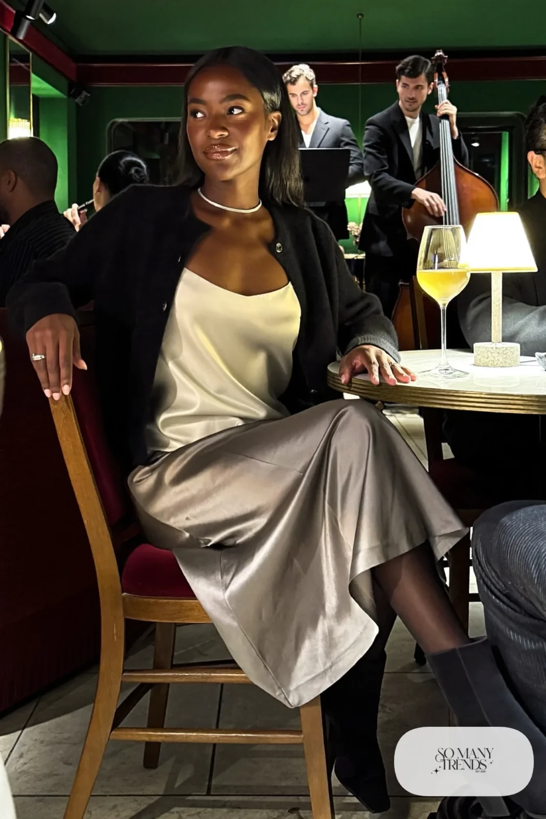 Pewter gray satin midi skirt with black merino cardigan over silk top and black ankle boots, outfit 26