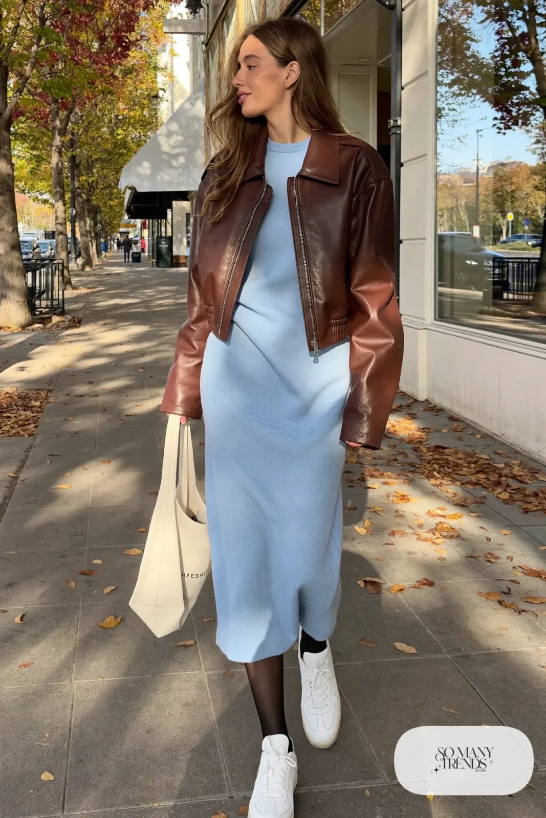 Brown leather bomber jacket over a baby blue midi dress with white leather sneakers, outfit 22