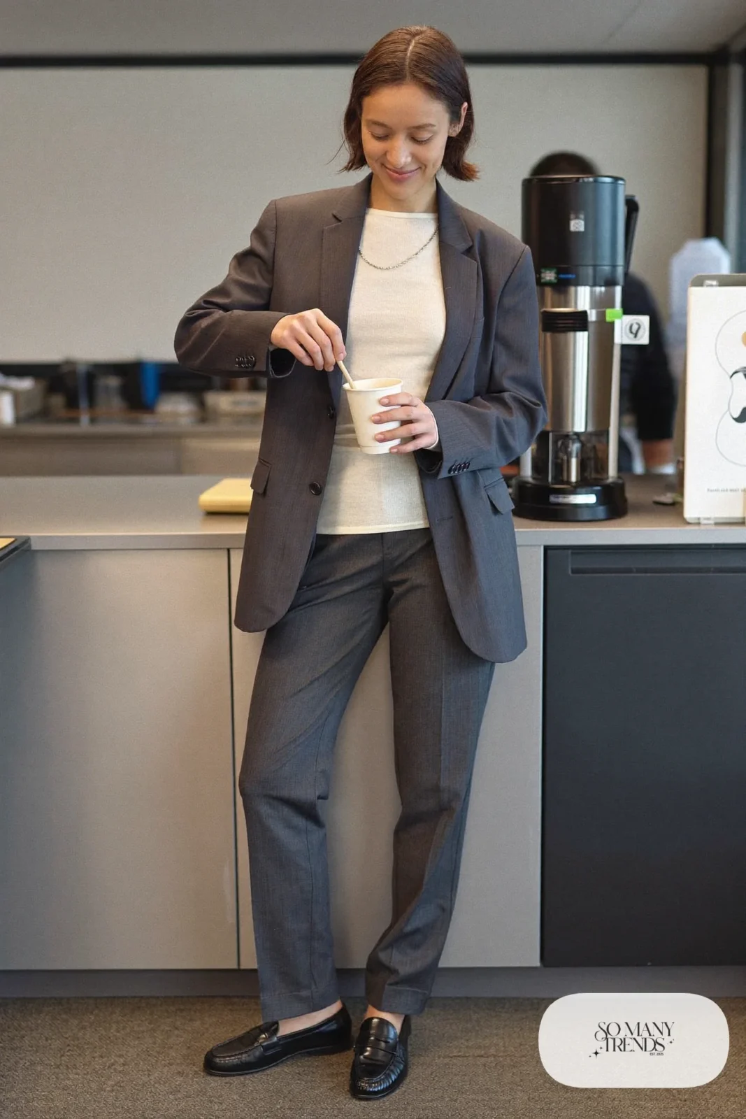 charcoal relaxed blazer over ivory knit shell with charcoal straight pants and black loafers, interview outfit 3