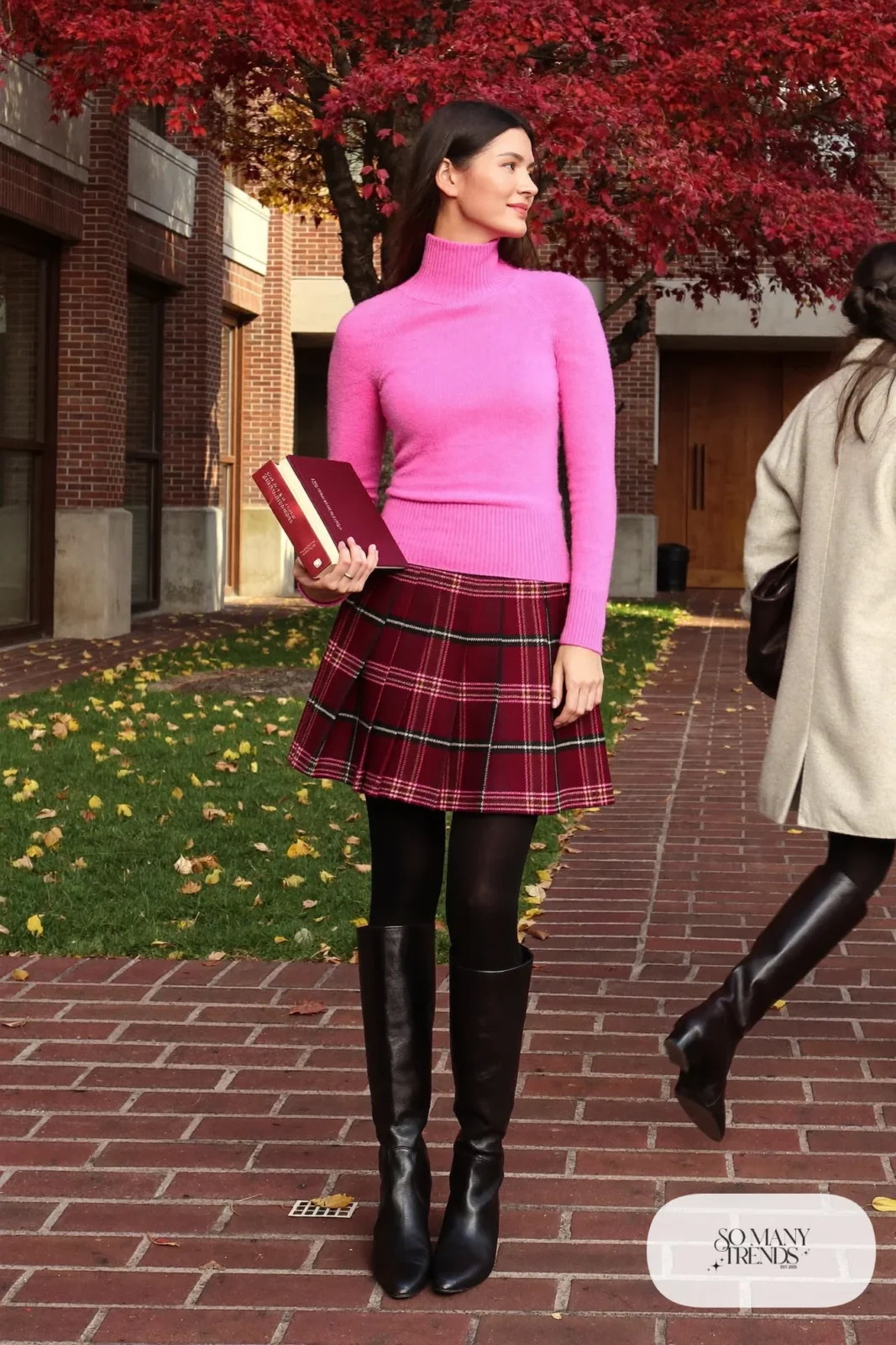 Woman in bubblegum pink turtleneck, wine plaid pleated midi skirt, black tights and black knee-high boots, outfit 14