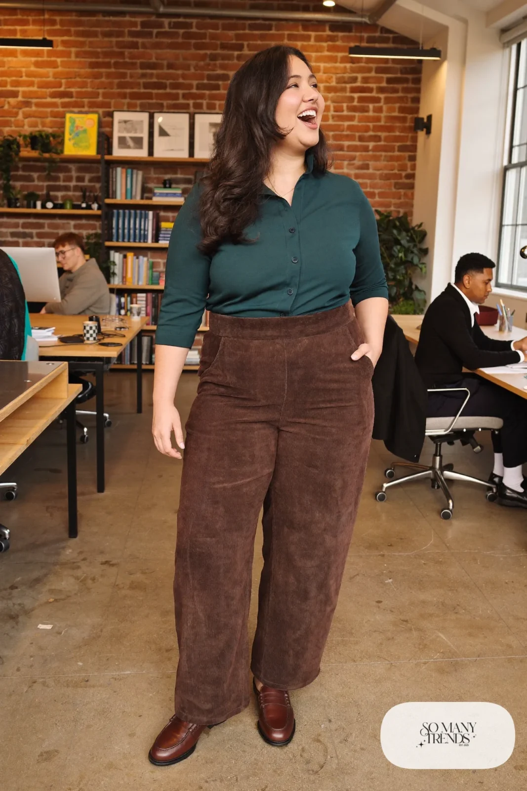Woman in teal crepe V-neck blouse, espresso corduroy wide-leg pants and cognac loafers, outfit 9