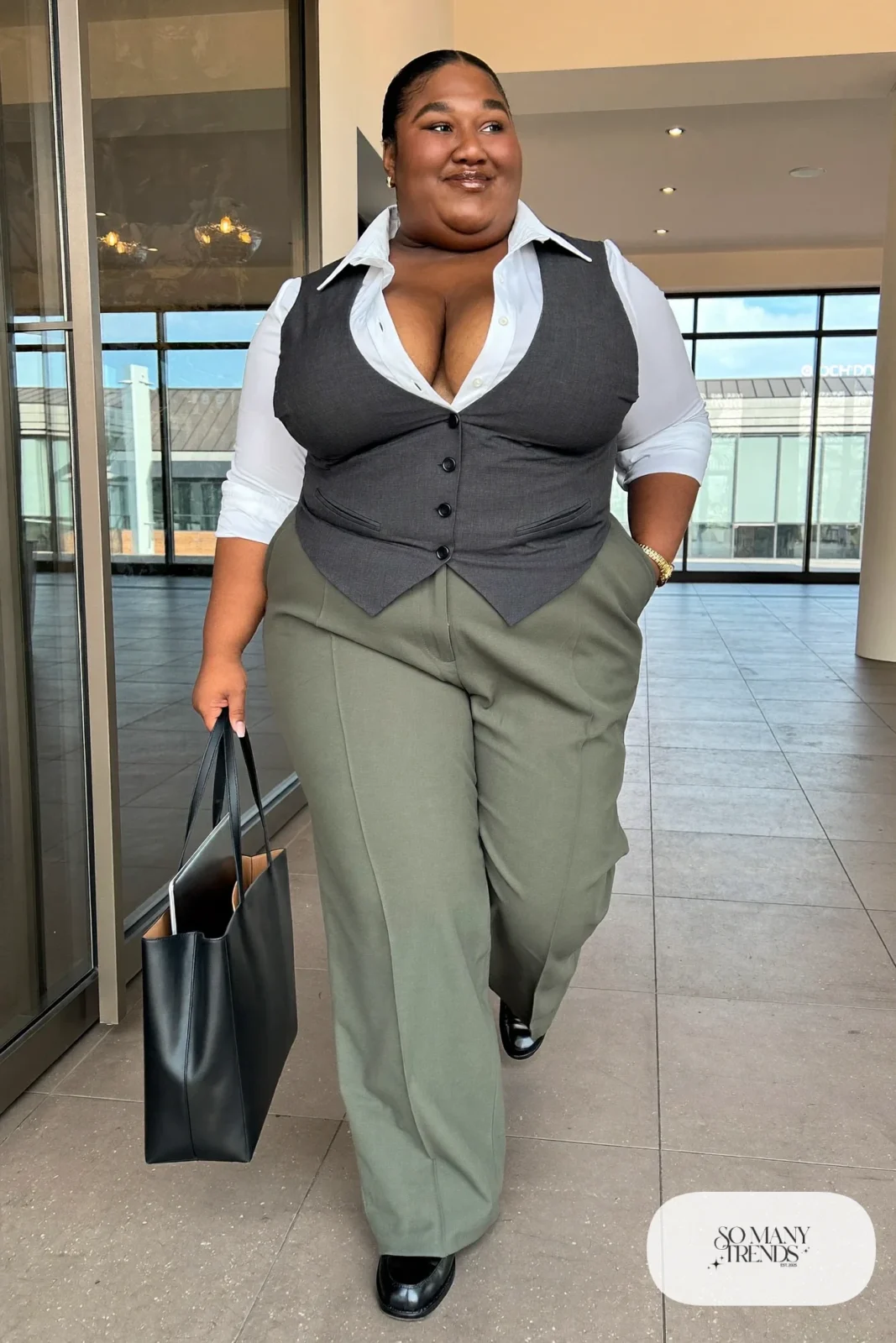 Woman in a charcoal tailored vest over a white shirt with sage straight-leg pants, outfit 4