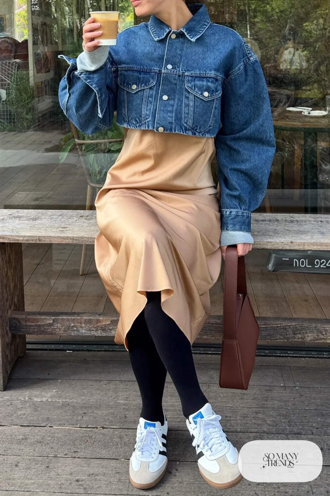 Woman with a straight athletic figure in a cropped denim jacket, a sand slip dress and white sneakers, outfit 18