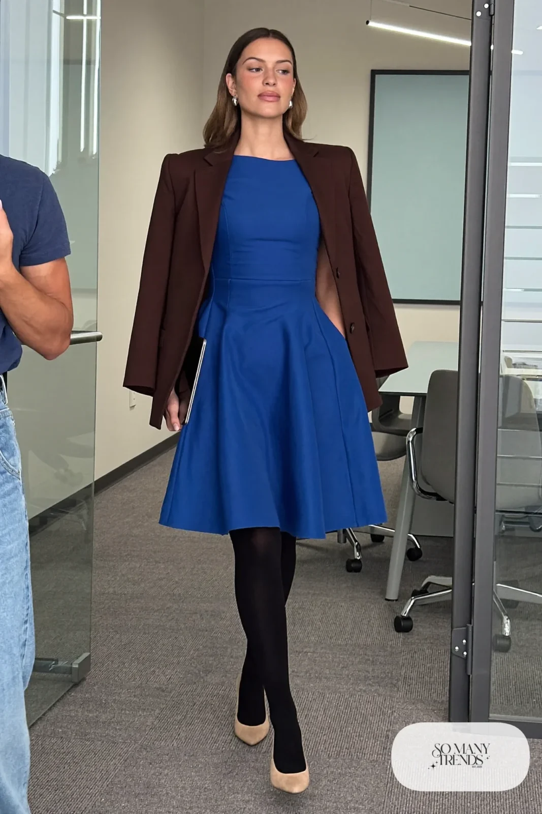 Woman with pear-shaped figure in a cobalt fit-and-flare dress, brown blazer and nude pumps, outfit 19