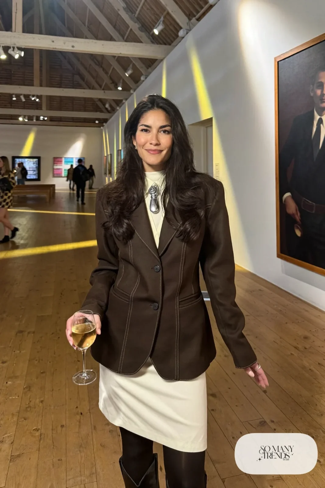 Brown western yoke blazer, cream pencil skirt, black tights, silver bolo tie and black cowboy boots, outfit 28