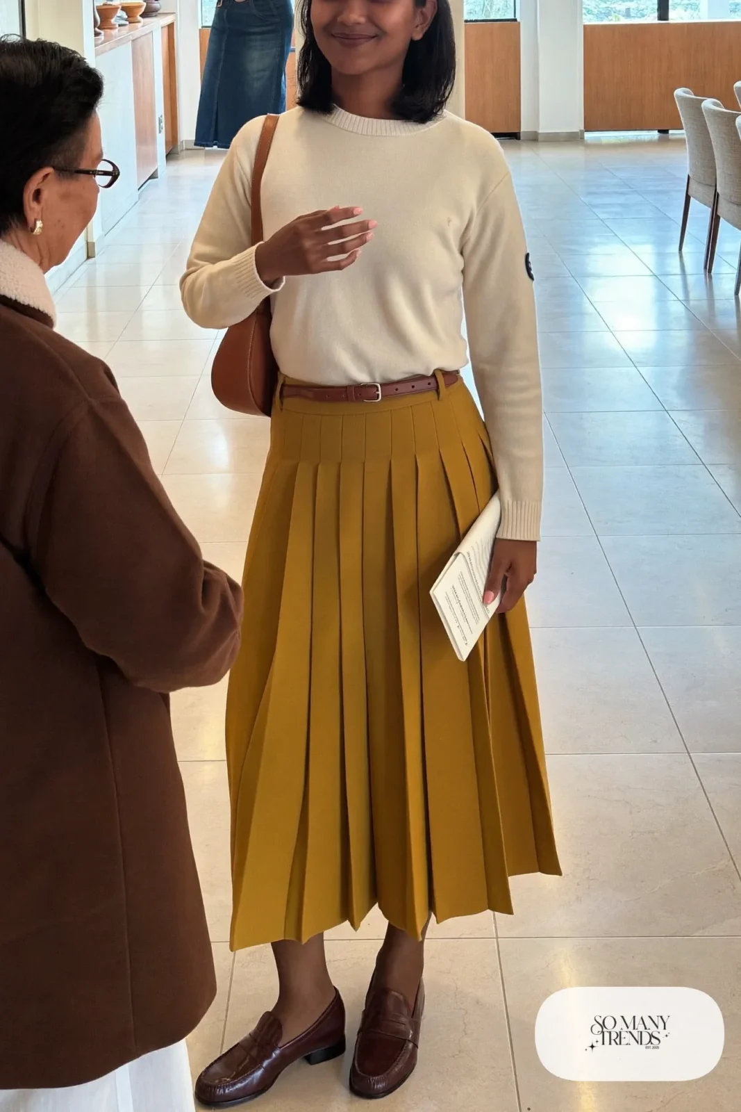 Mustard pleated midi skirt, cream fine-knit sweater, brown belt, brown tights and brown loafers - outfit 1