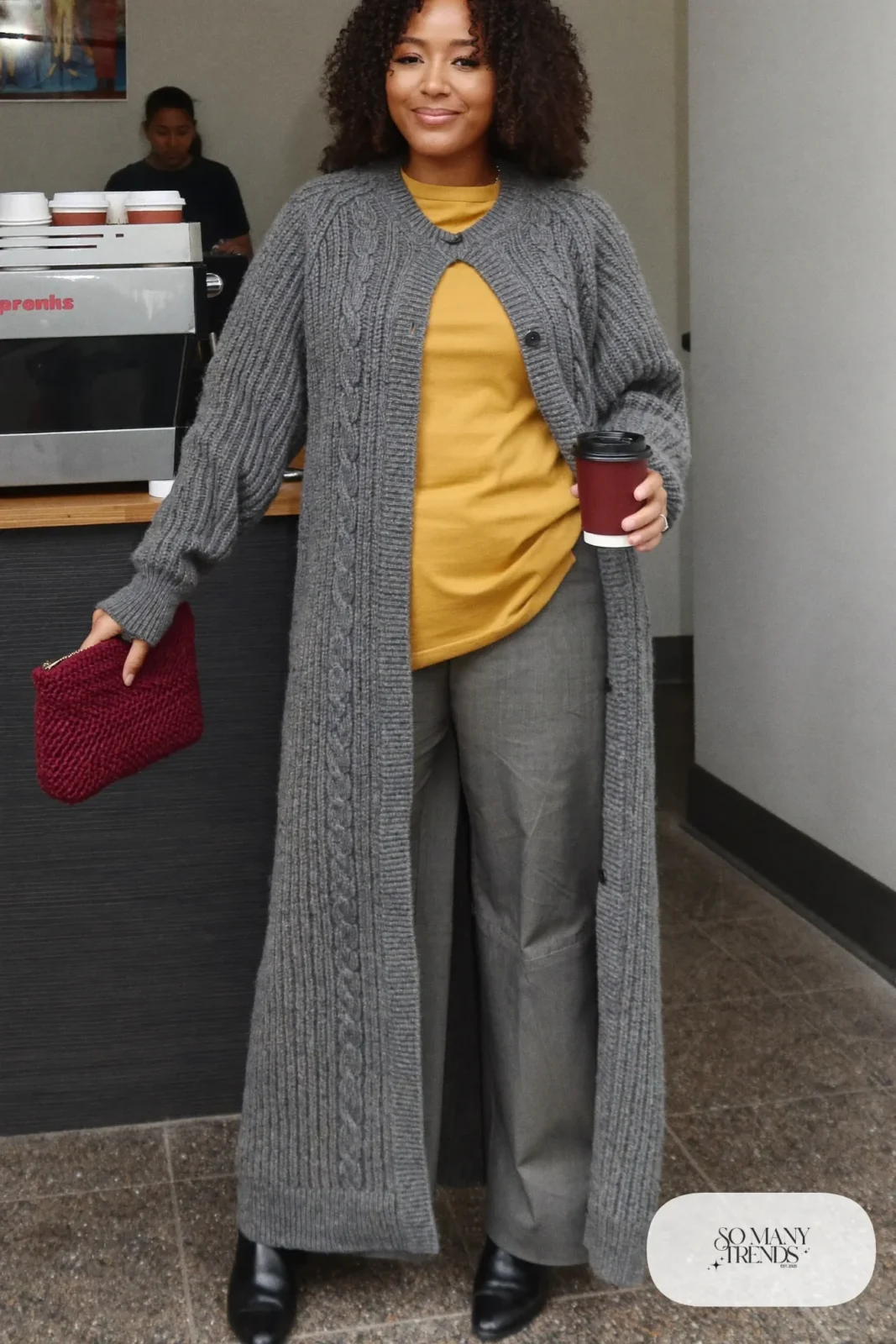 Long gray cable cardigan, mustard tee, gray wide pants and black ankle boots - outfit 15
