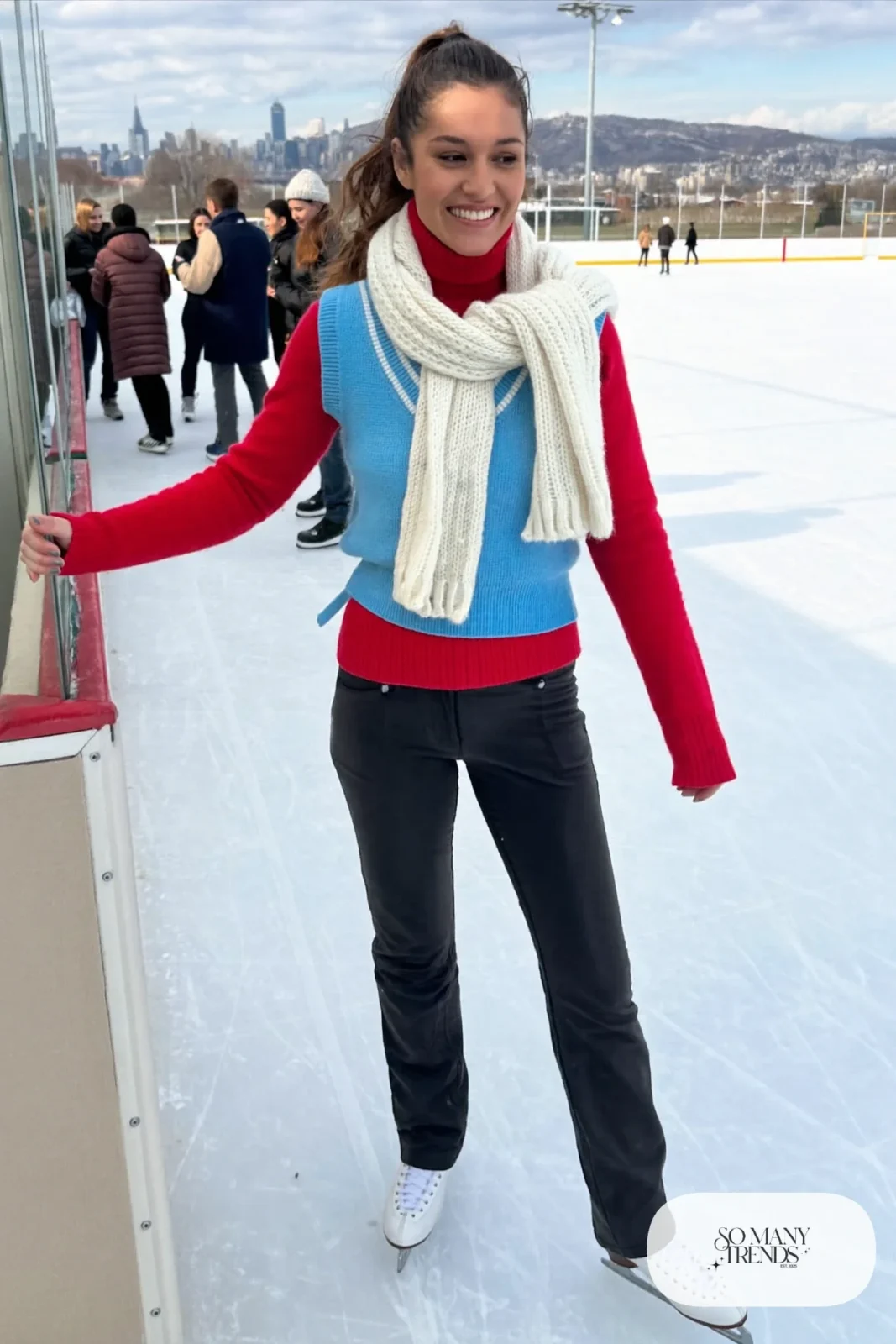 Sky blue knit vest over cranberry turtleneck, black stretch pants, cream scarf and ice skates - outfit 14