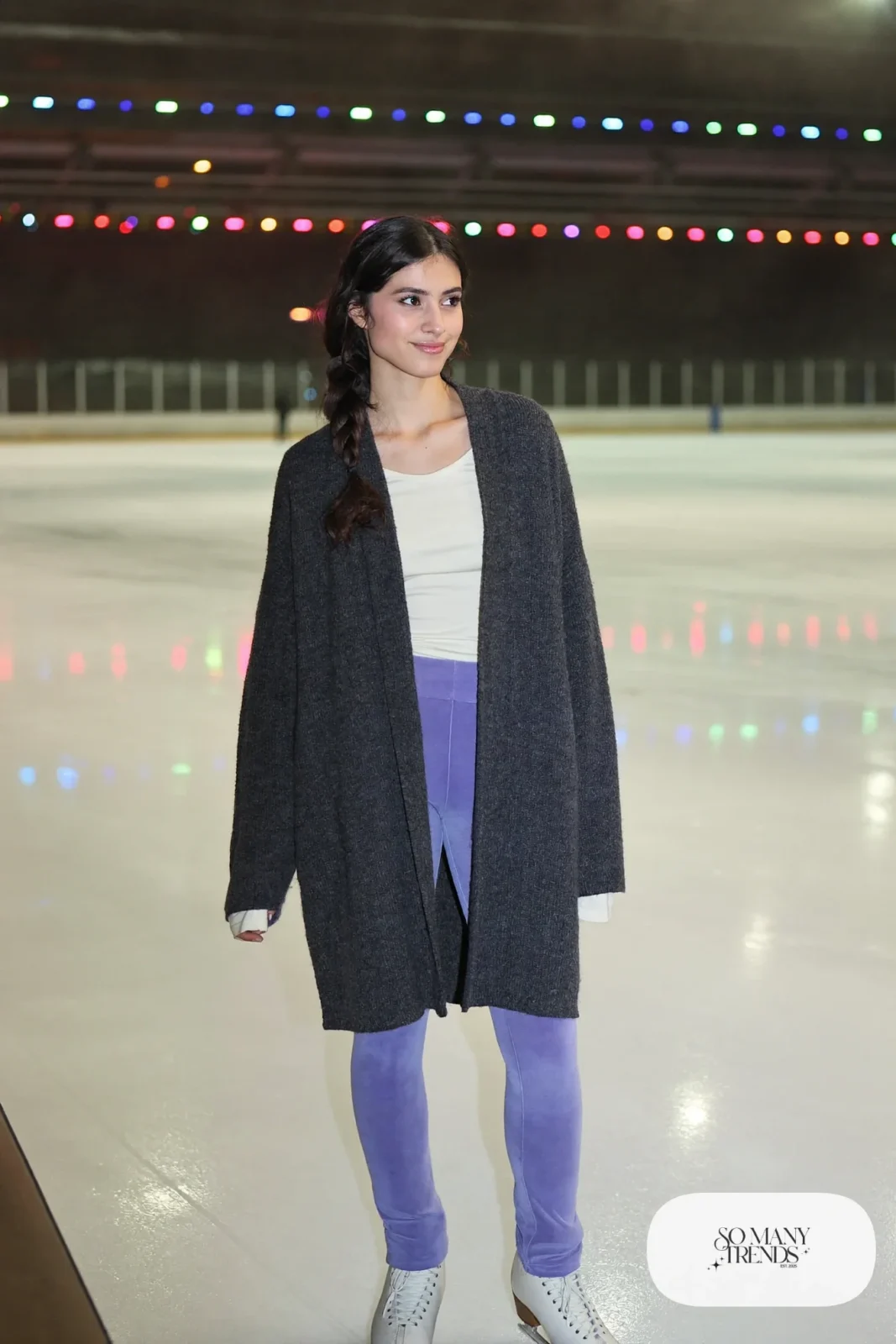 Oversized charcoal wool-blend cardigan over cream long-sleeve tee, lilac fleece leggings and ice skates - outfit 16