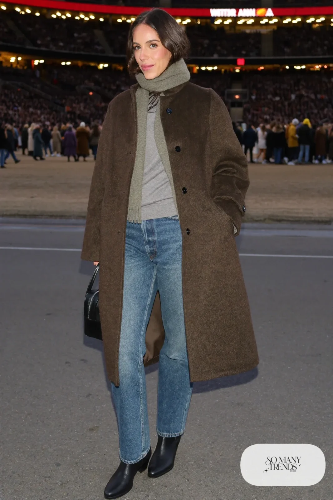 Woman in a long espresso wool coat, gray knit, straight jeans and sage scarf, basketball game outfit 17