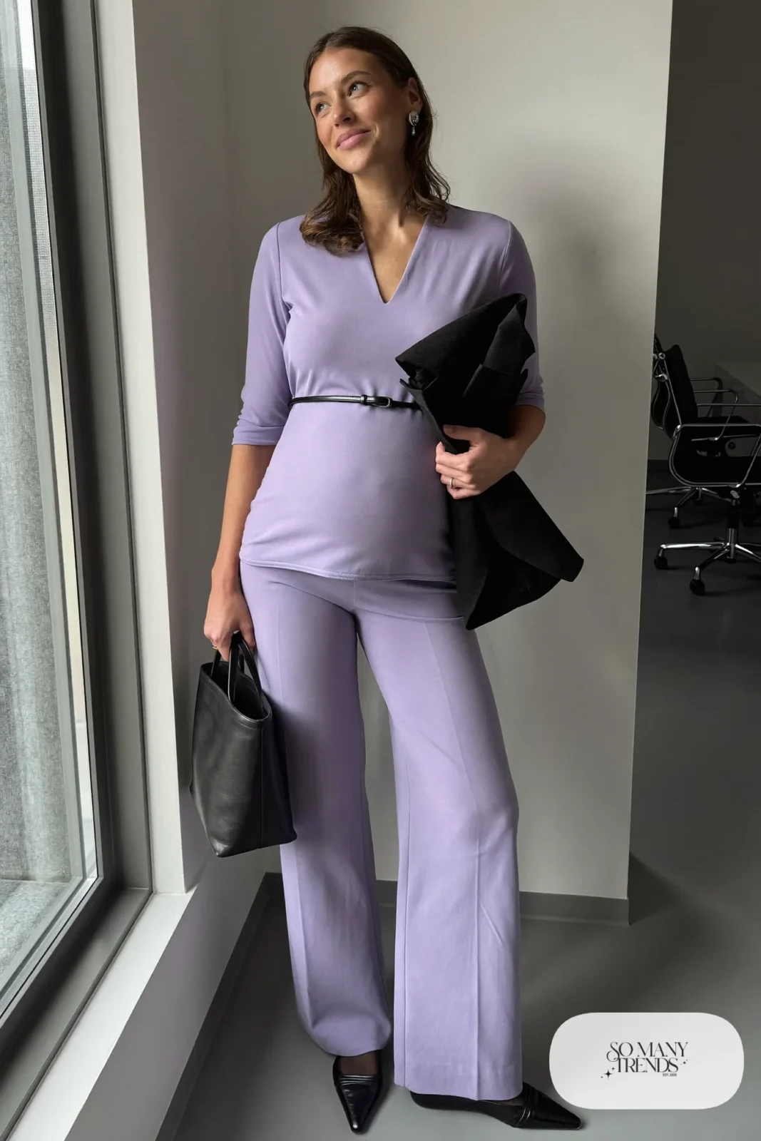 Lavender crepe maternity wide-leg jumpsuit with black belt, black flats and blazer over arm - outfit 24