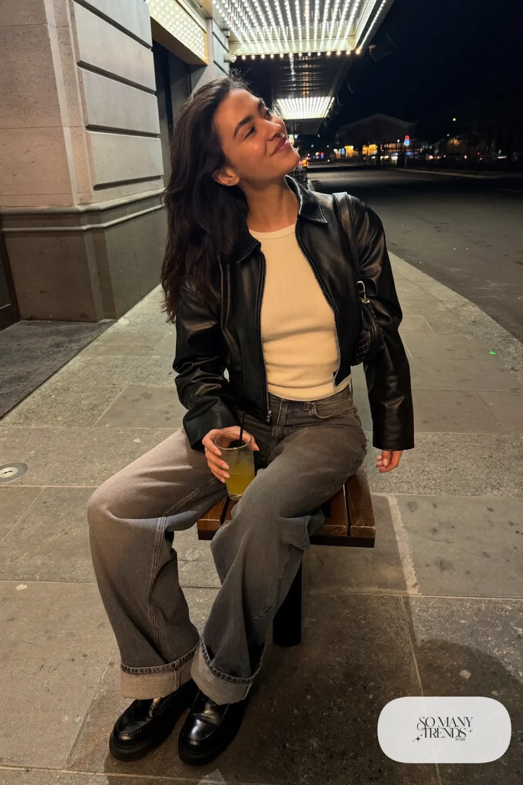 Black cropped leather jacket, champagne knit tee, relaxed wide-leg jeans and chunky black loafers, winter date outfit 16