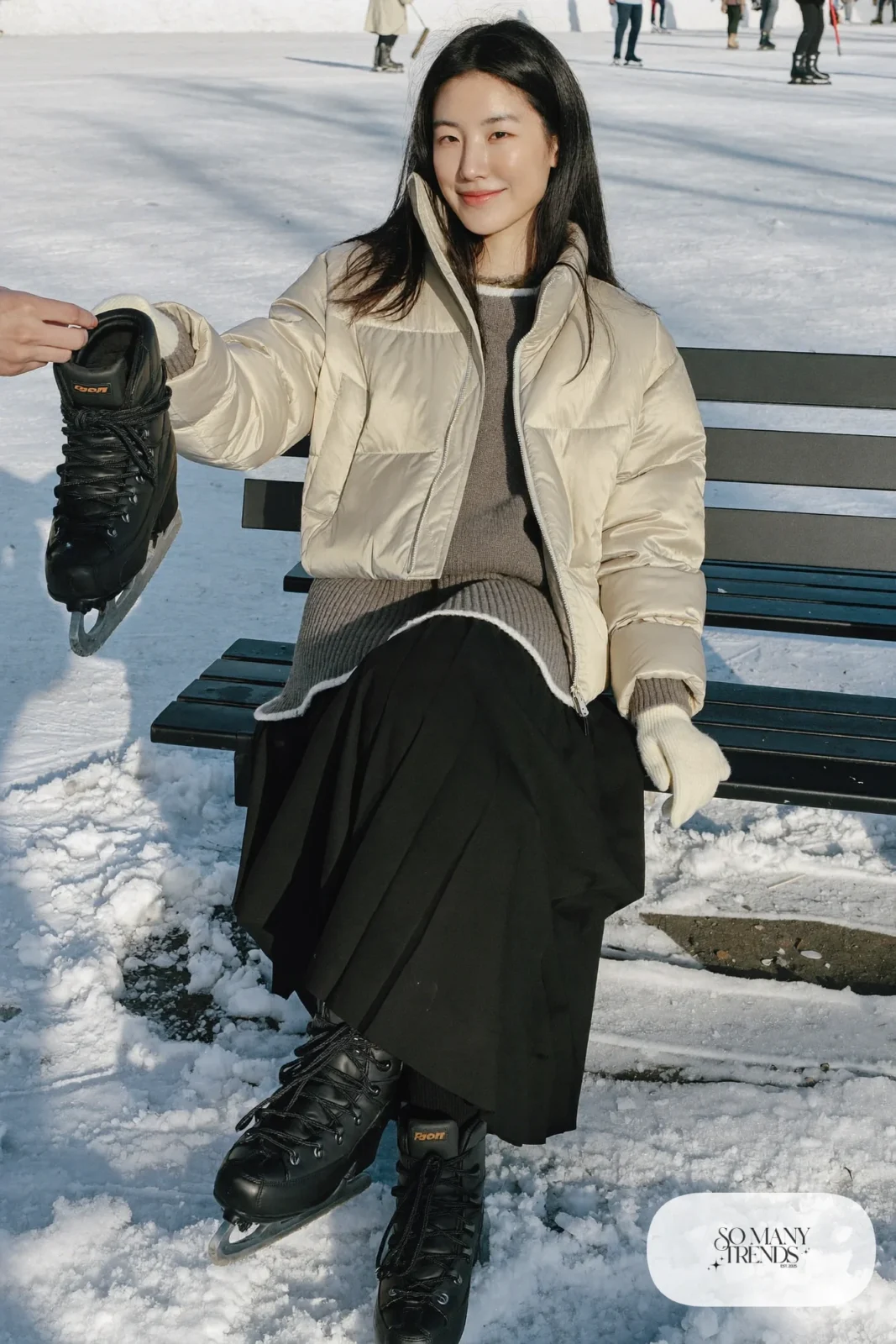 Champagne quilted jacket, chunky knit sweater, black pleated skirt with thermal tights and winter boots, winter date outfit 24