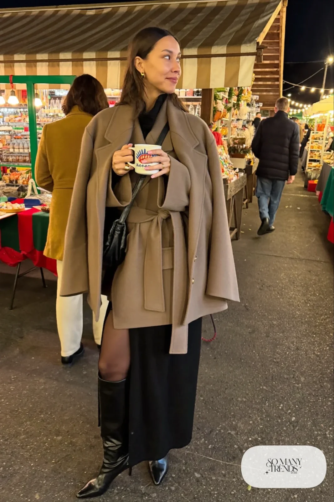 Black long-sleeve knit midi dress, taupe wool wrap coat, tall black boots and small crossbody bag, winter date outfit 26