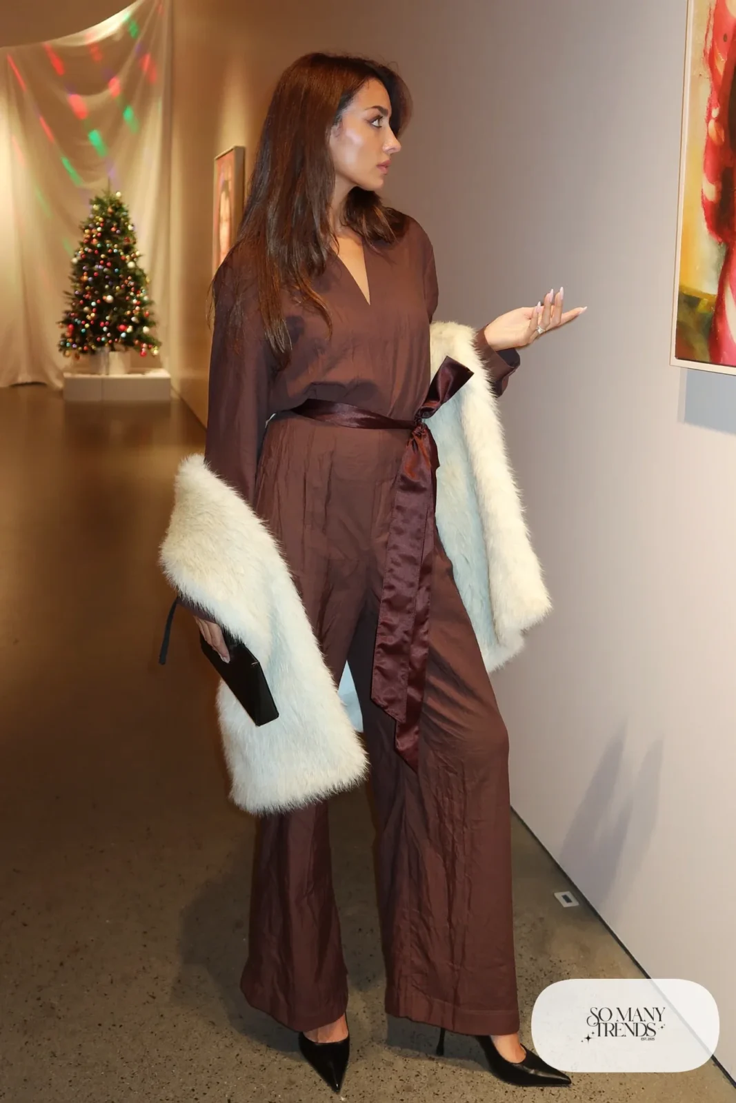 Look 17: chocolate crepe wide-leg jumpsuit, satin bow belt, cream faux fur stole, pointed pumps