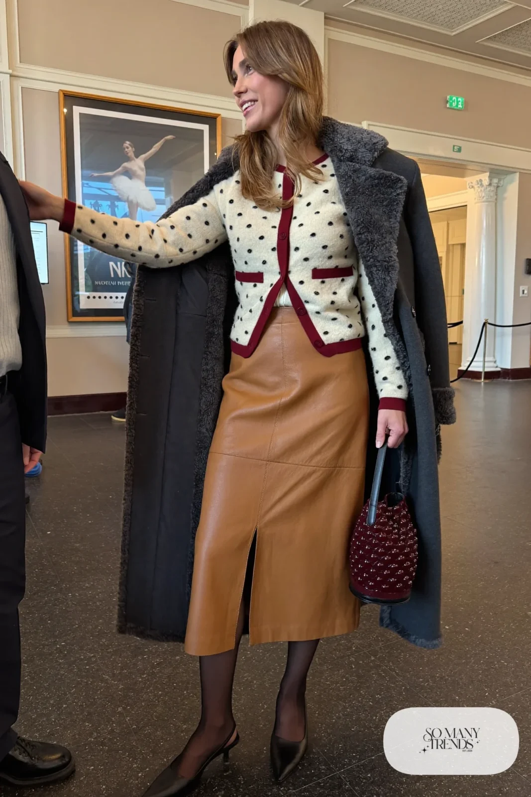 camel faux leather midi skirt, cream bobble knit cardigan with burgundy trim, black tights, black slingbacks, burgundy beaded bag, nutcracker outfit 10