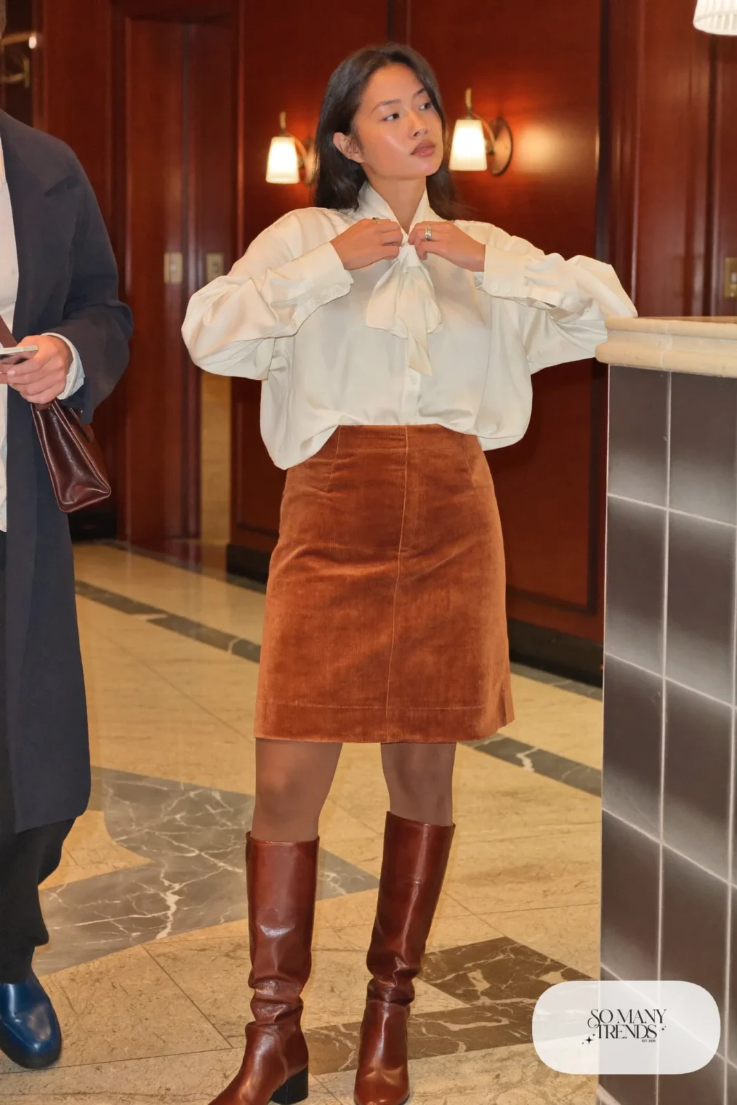 rust corduroy midi skirt, ivory bow-neck blouse, brown tights, brown tall boots, nutcracker outfit 12