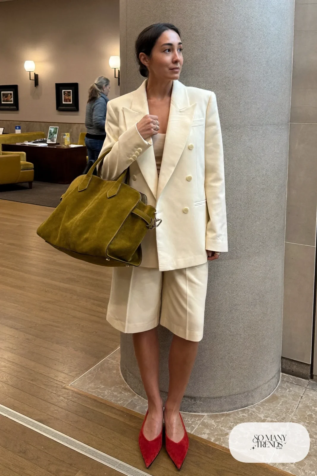 cream double-breasted blazer, cream tailored wide shorts, black opaque tights, red pointed ankle booties, tan leather trench coat, nutcracker outfit 14