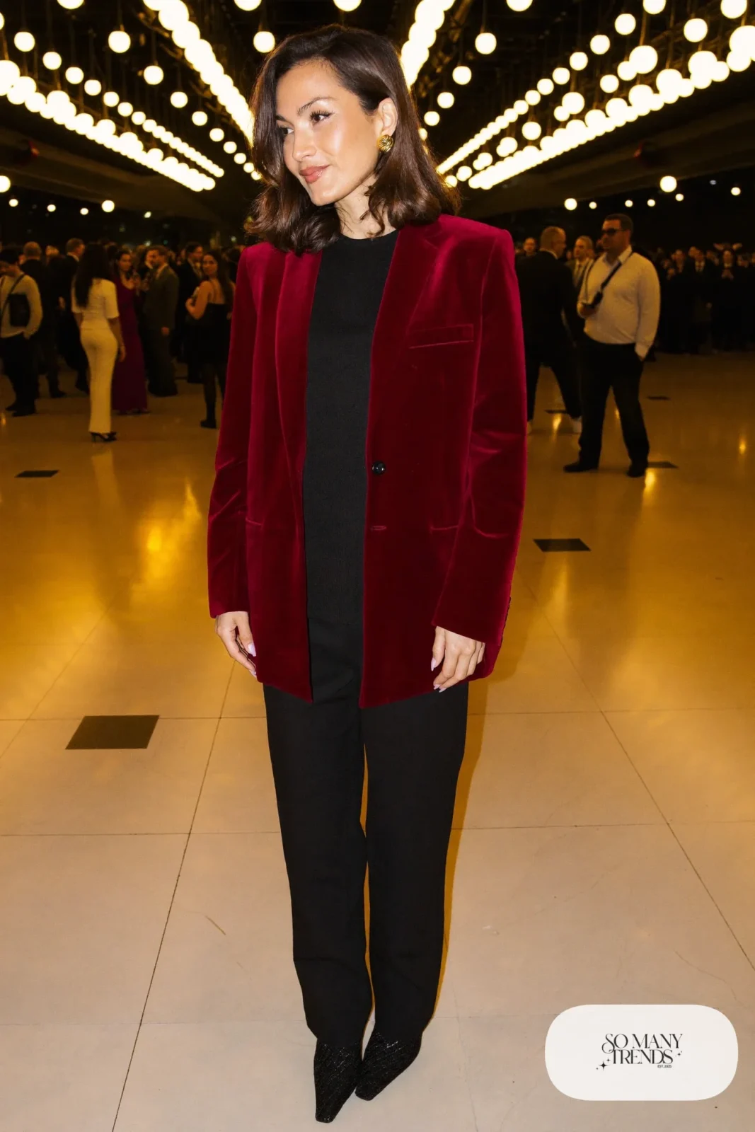 burgundy velvet relaxed blazer, black fine-knit top, black straight-leg pants, black pointed ankle boots, gold hoops, nutcracker outfit 16