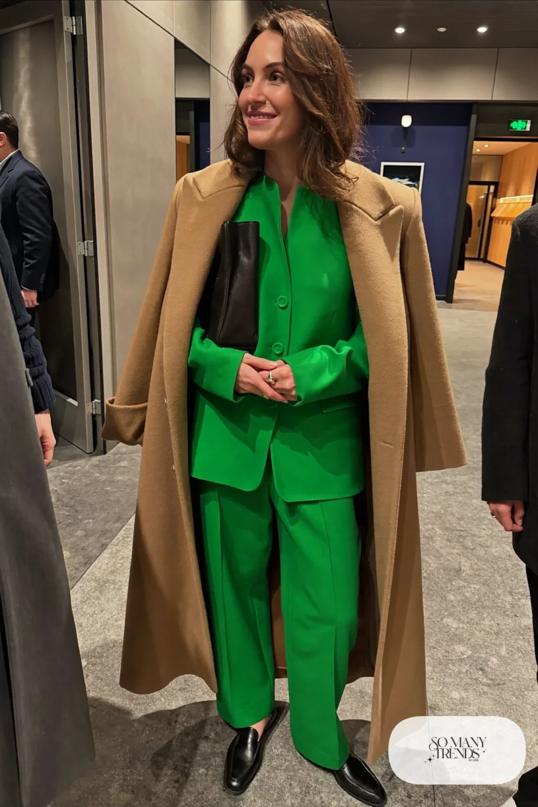 emerald green blazer and wide-leg pants set, camel wool overcoat, black loafers, black bag, nutcracker outfit 17